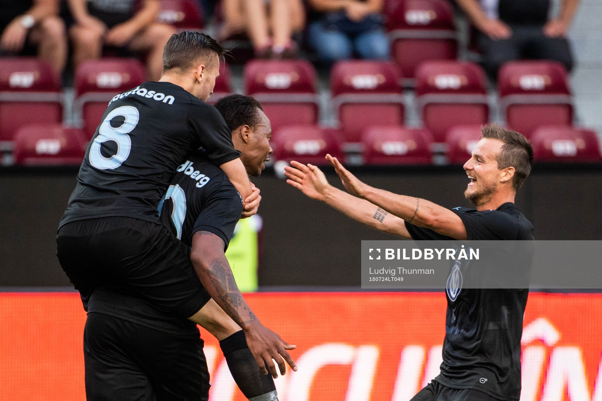 Arnór Ingvi Traustason jumps on to Carlos Strandberg who celebrates with Eric Larsson after scoring 0-1 during the UEFA Champions League qualifying match between Cluj and Malmö FF on July 24, 2018 in Cluj.