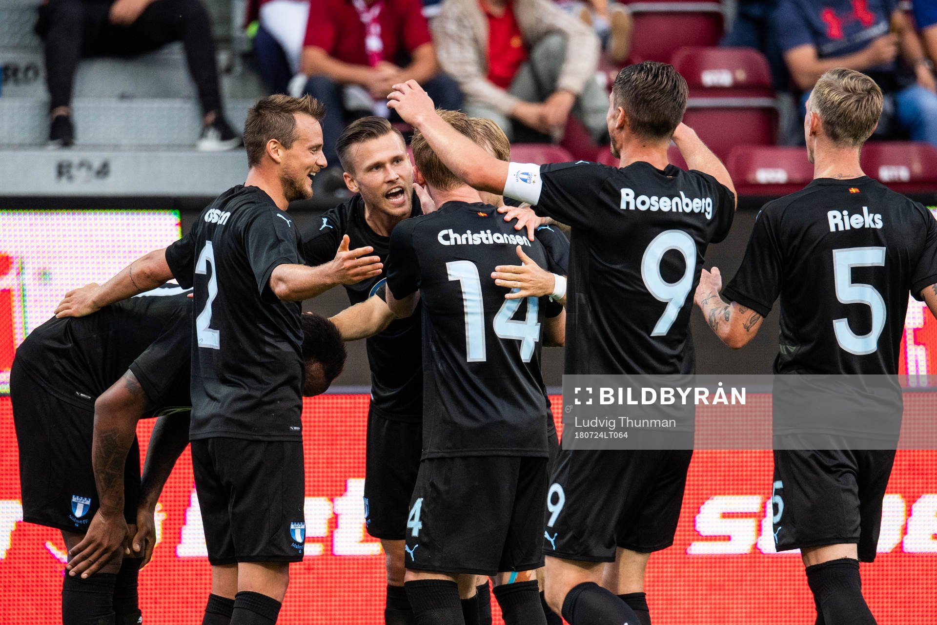Carlos Strandberg (left) of Malmö FF celebrates scoring