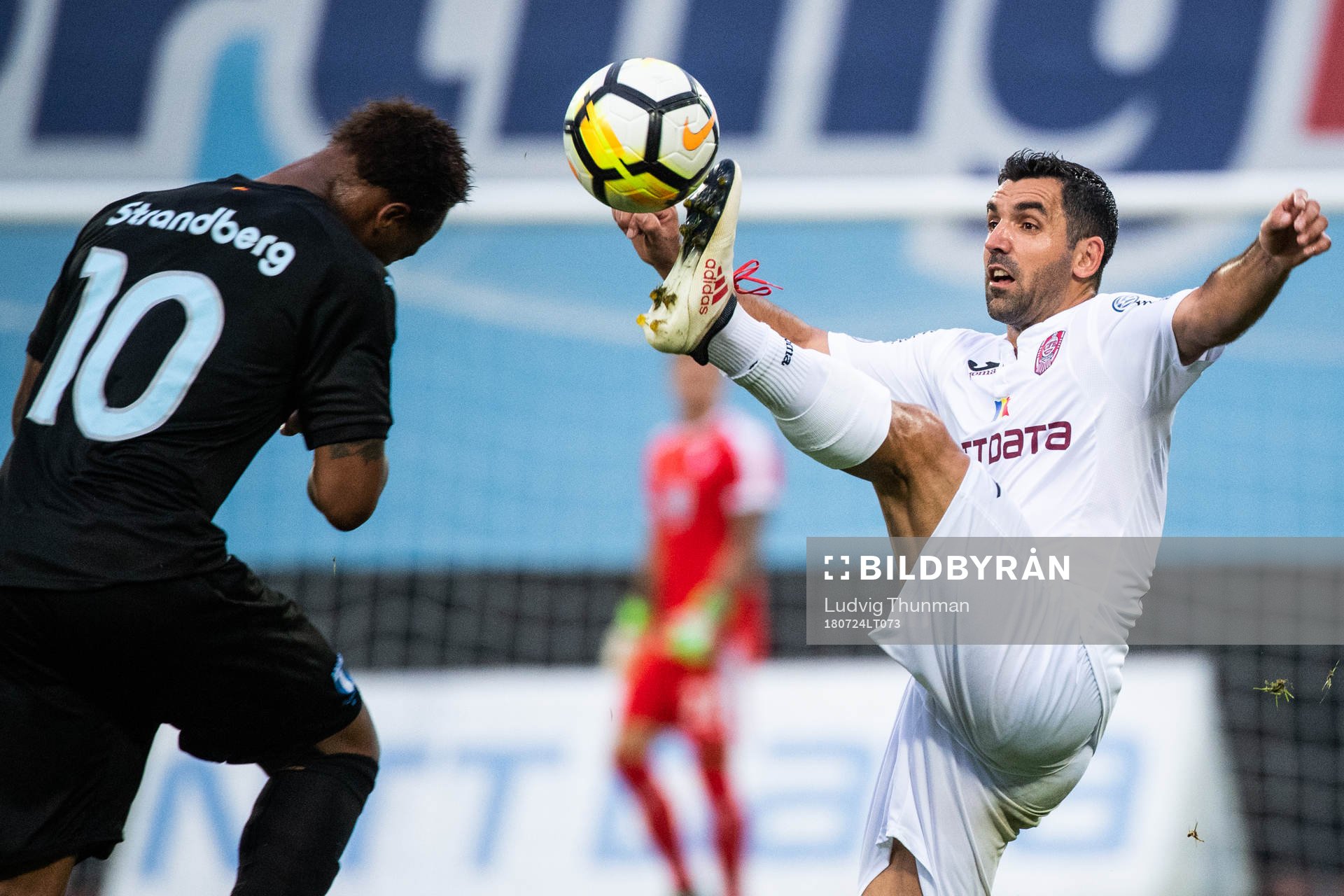 Carlos Strandberg of Malmö FF and Emmanuel Culio of Cluj