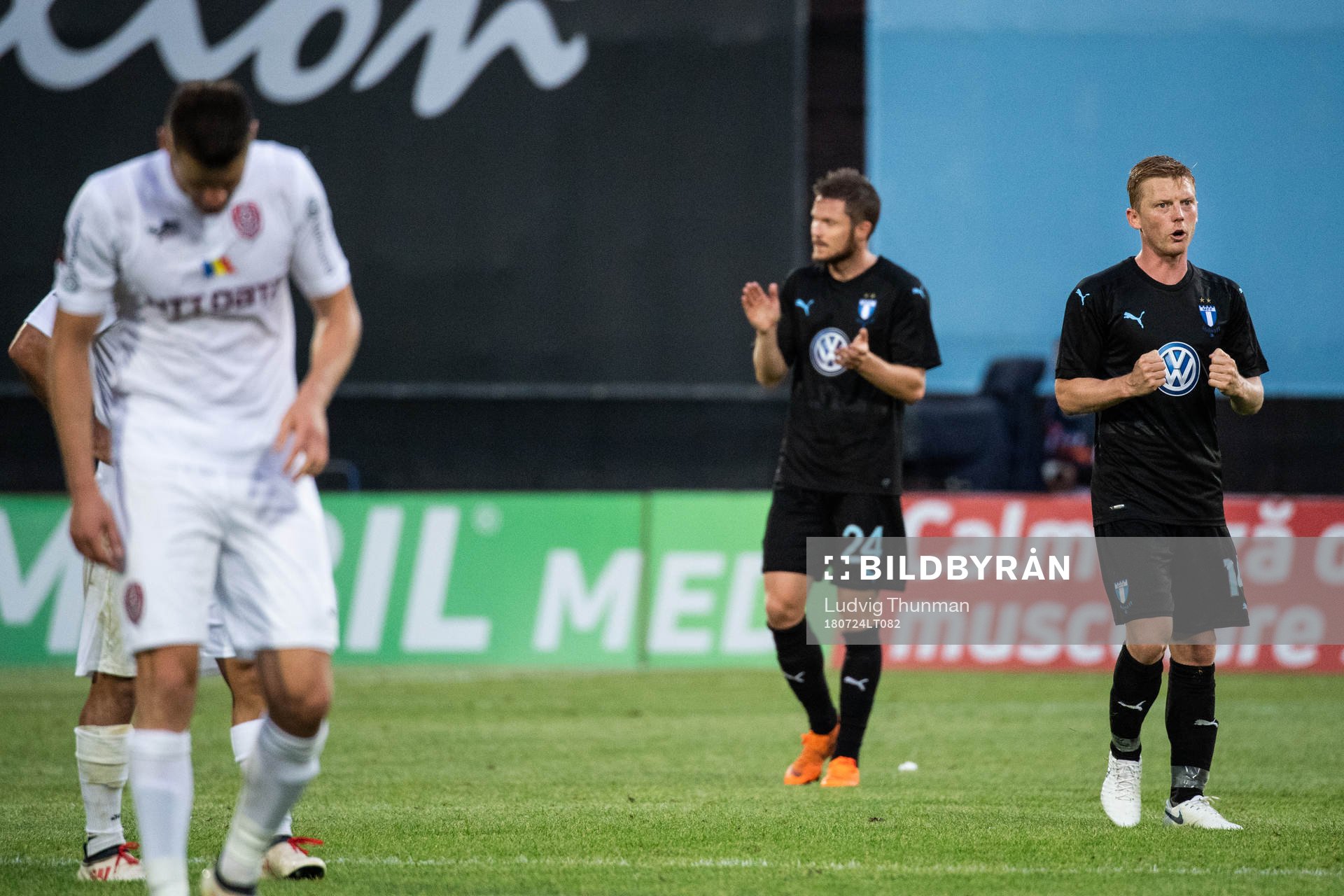 Behrang Safari and Lasse Nielsen of Malmö FF celebrate after winning the UEFA Champions League qualifying match between Cluj and Malmö FF on July 24, 2018 in Cluj.
