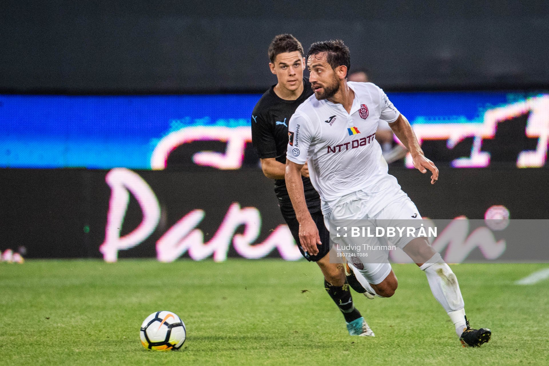 Samuel Adrian of Malmö FF chasing Mate Males of Cluj