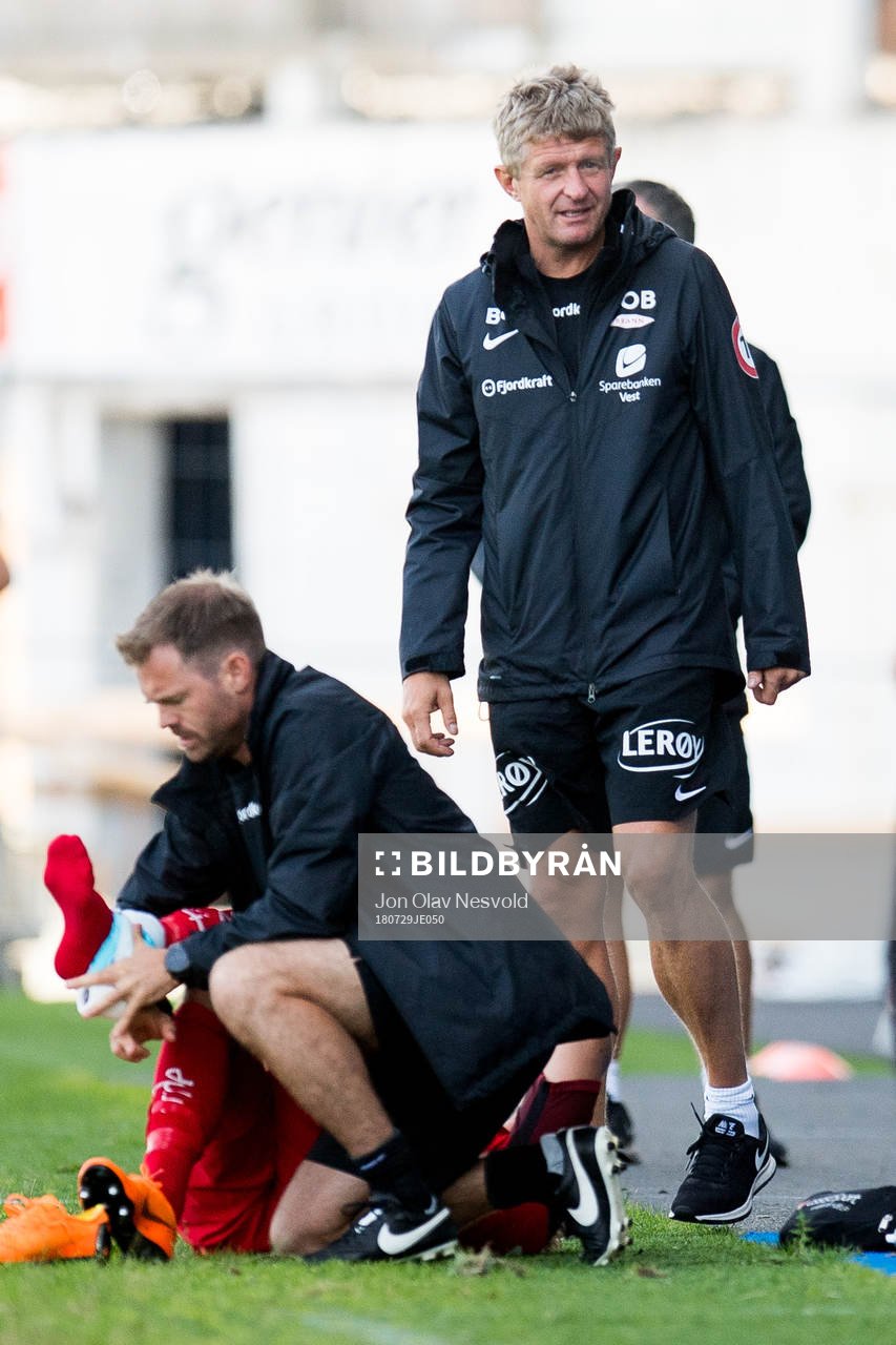 Steffen Lie Skålevik of Brann with an injury and Lars Arne