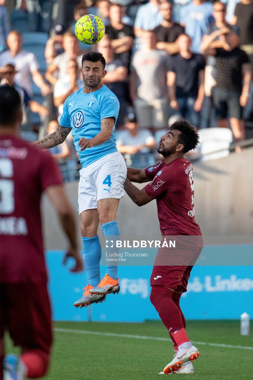 Behrang Safari of Malmö FF and Billel Omrani of Cluj