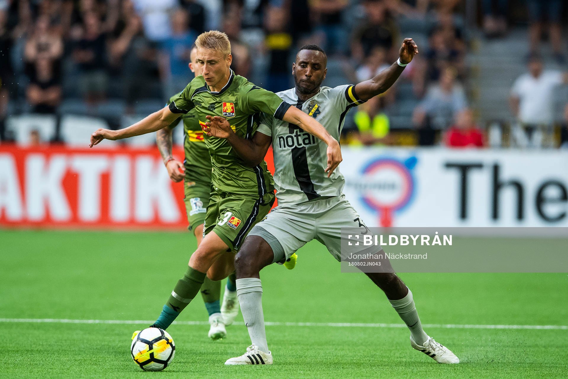Henok Goitom of AIK vies with Ulrik Yttergård Jenssen of