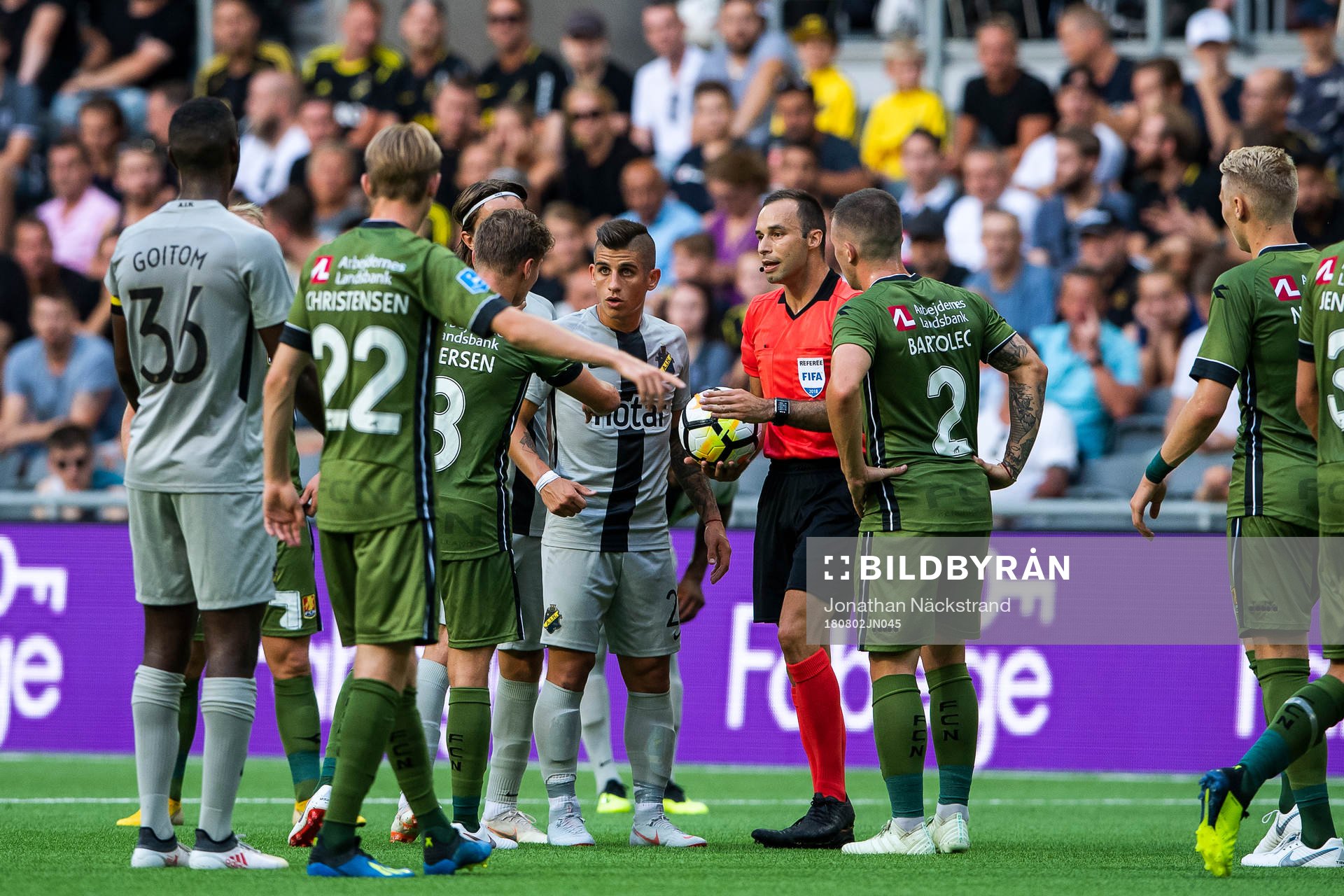 Players of of AIK and of Nordsjälland argue with match