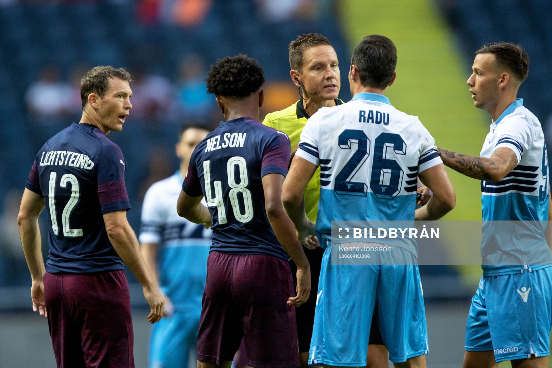 Stephan Lichtsteiner of Arsenal and Stefan Radu of Lazio