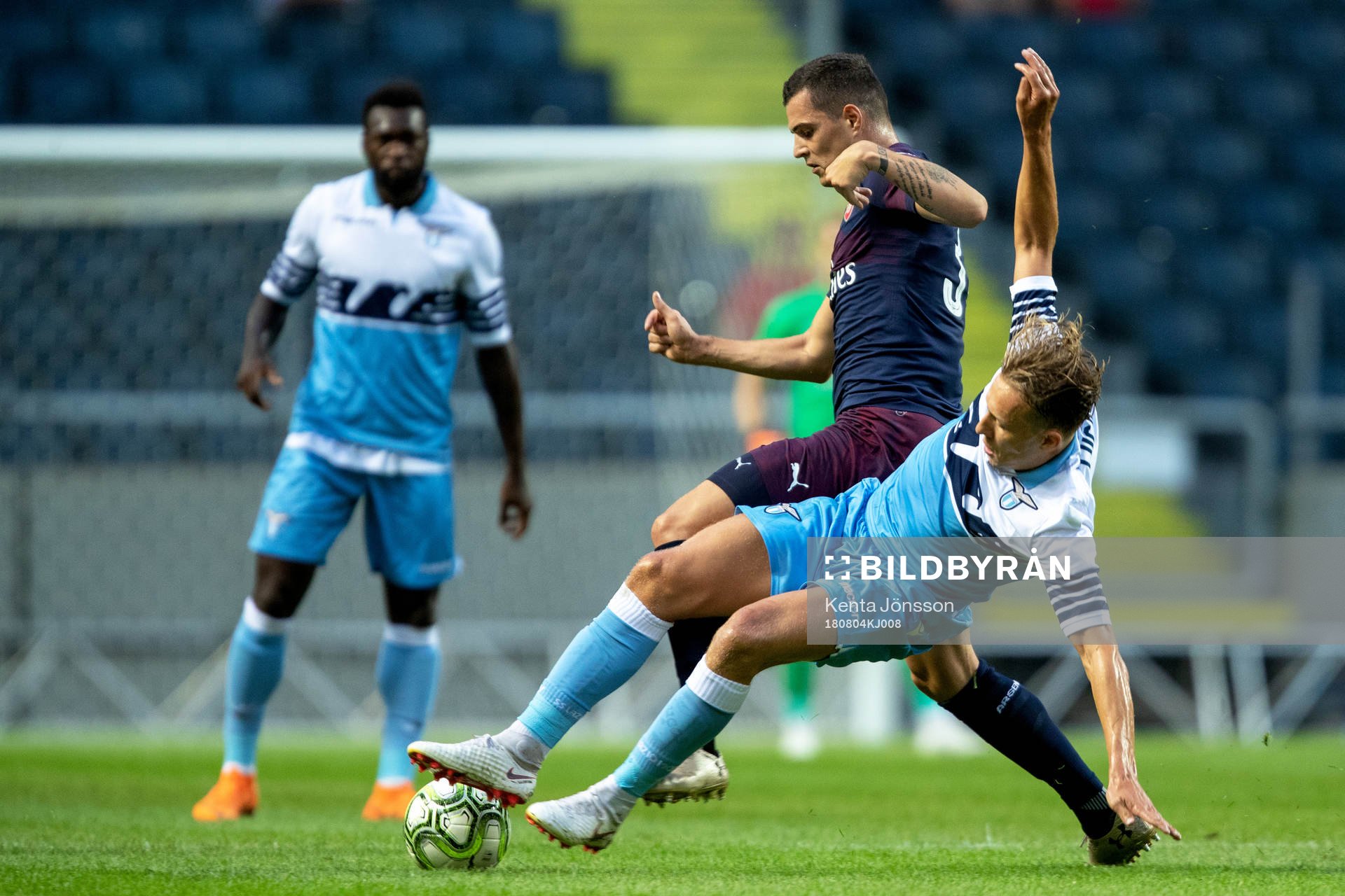 Granit Xhaka of Arsenal and Lucas Leiva of Lazio