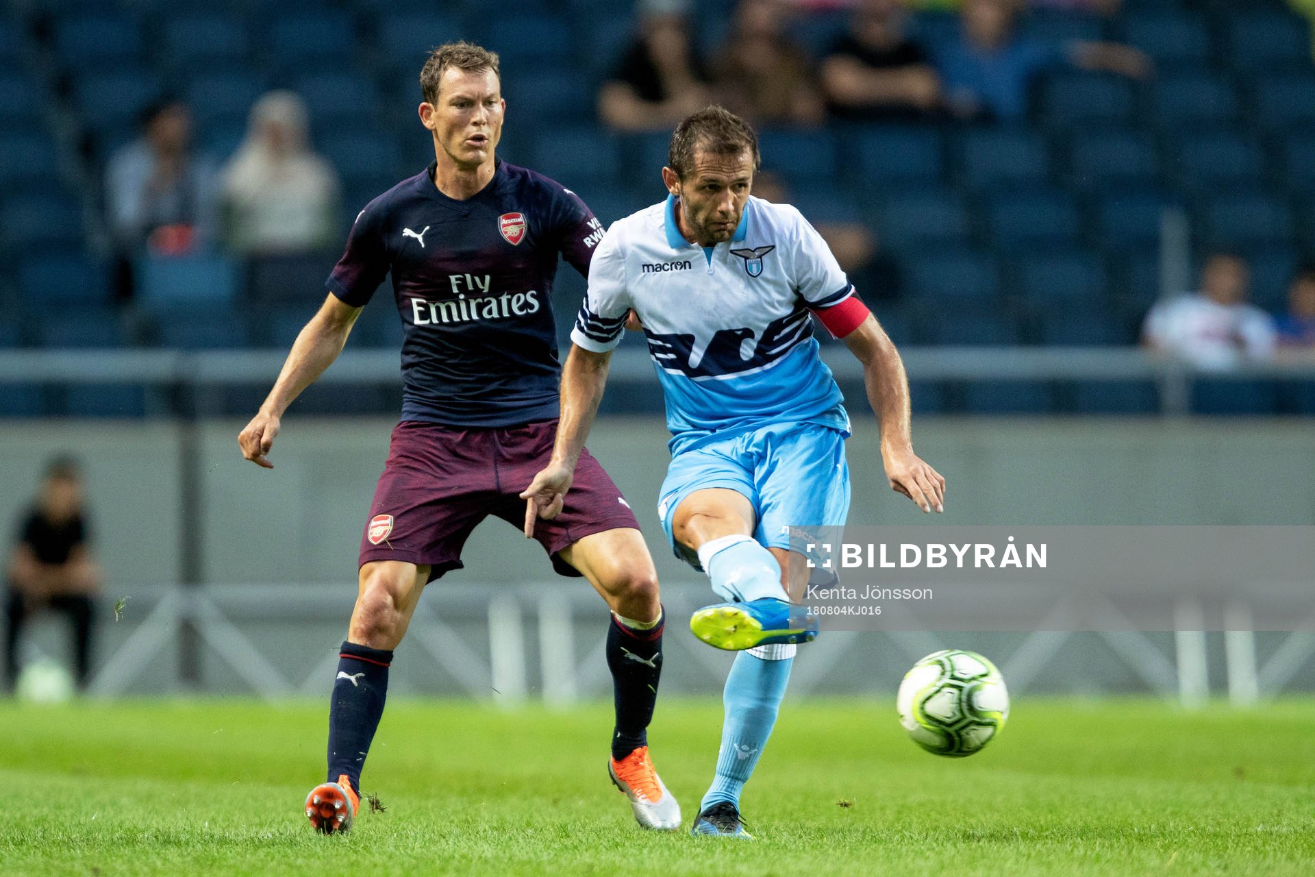 Stephan Lichtsteiner of Arsenal and Senad Lulic of Lazio