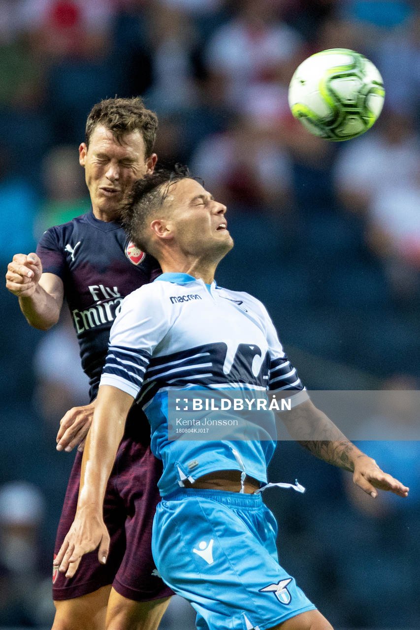 Stephan Lichtsteiner of Arsenal and Stefan Radu of Lazio