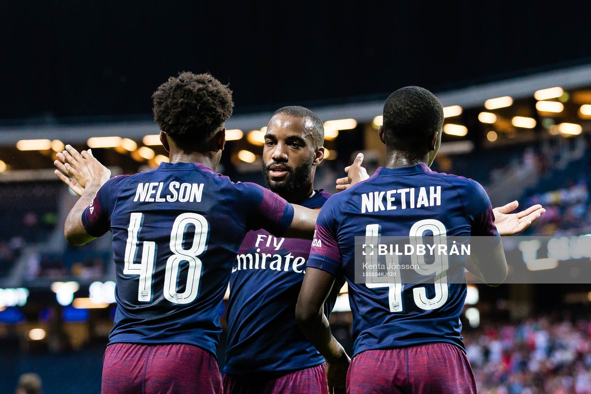 Alexandre Lacazette of Arsenal celebrates with Reiss Nelson of Arsenal after 1-0 during the International Champions Cup match between Arsenal and Lazio on August 4, 2018 in Stockholm. 
