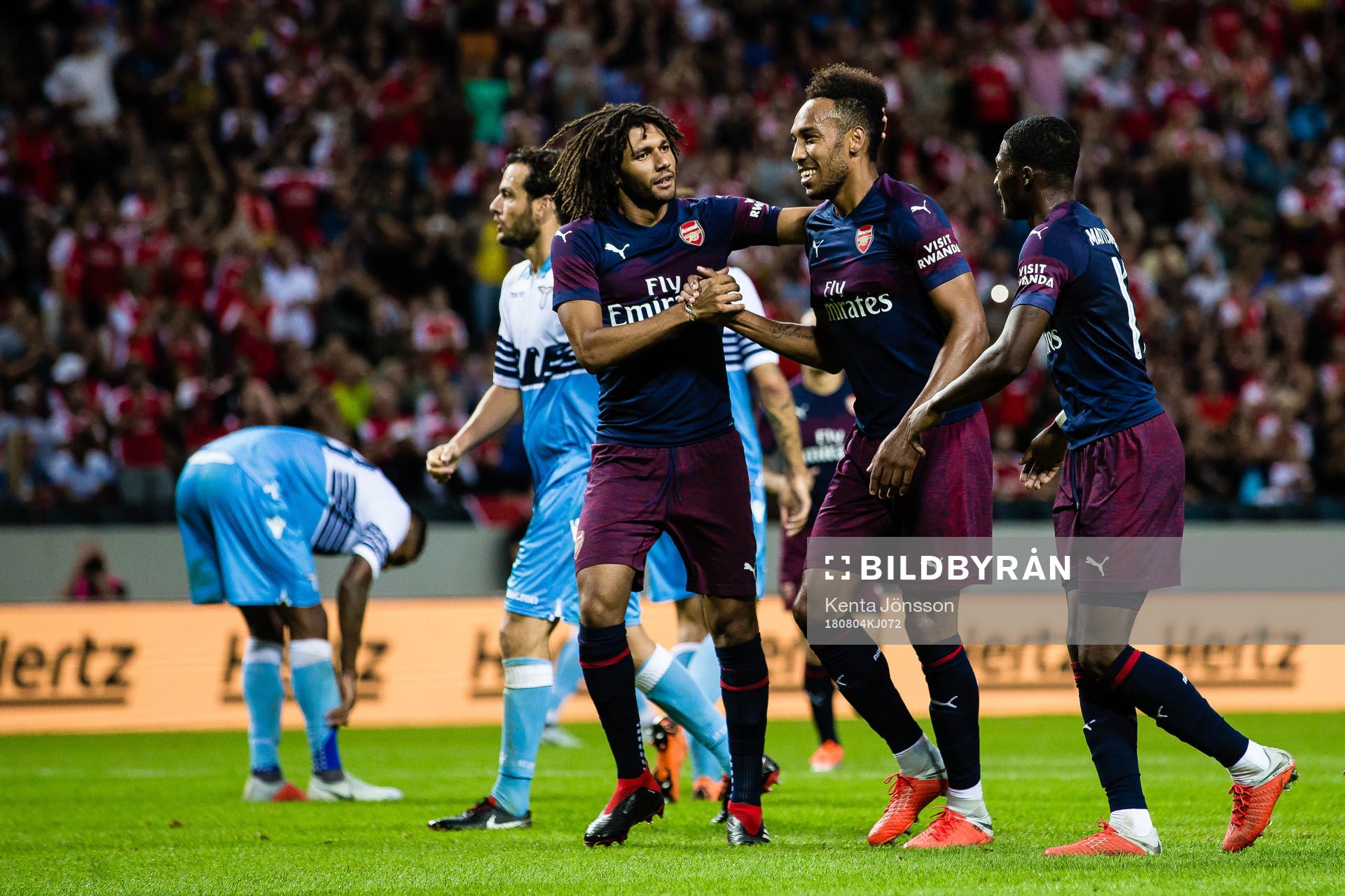 Pierre-Emerick Aubameyang of Arsenal celebrates with teammates Mohamed Elneny och Ainsley Maitland-Niles after 2-0 during the International Champions Cup match between Arsenal and Lazio on August 4, 2018 in Stockholm.