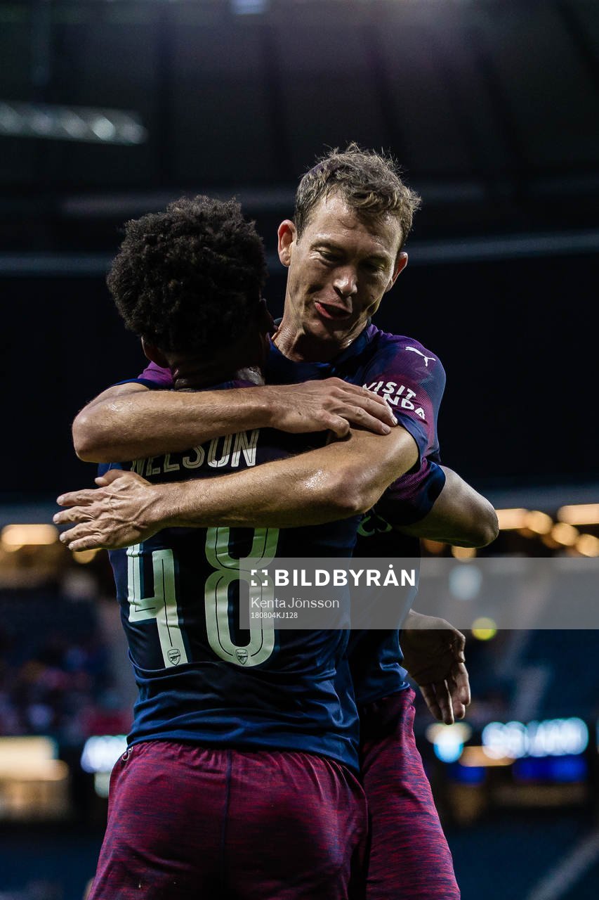 Stephan Lichtsteiner of Arsenal celebrates with Reiss