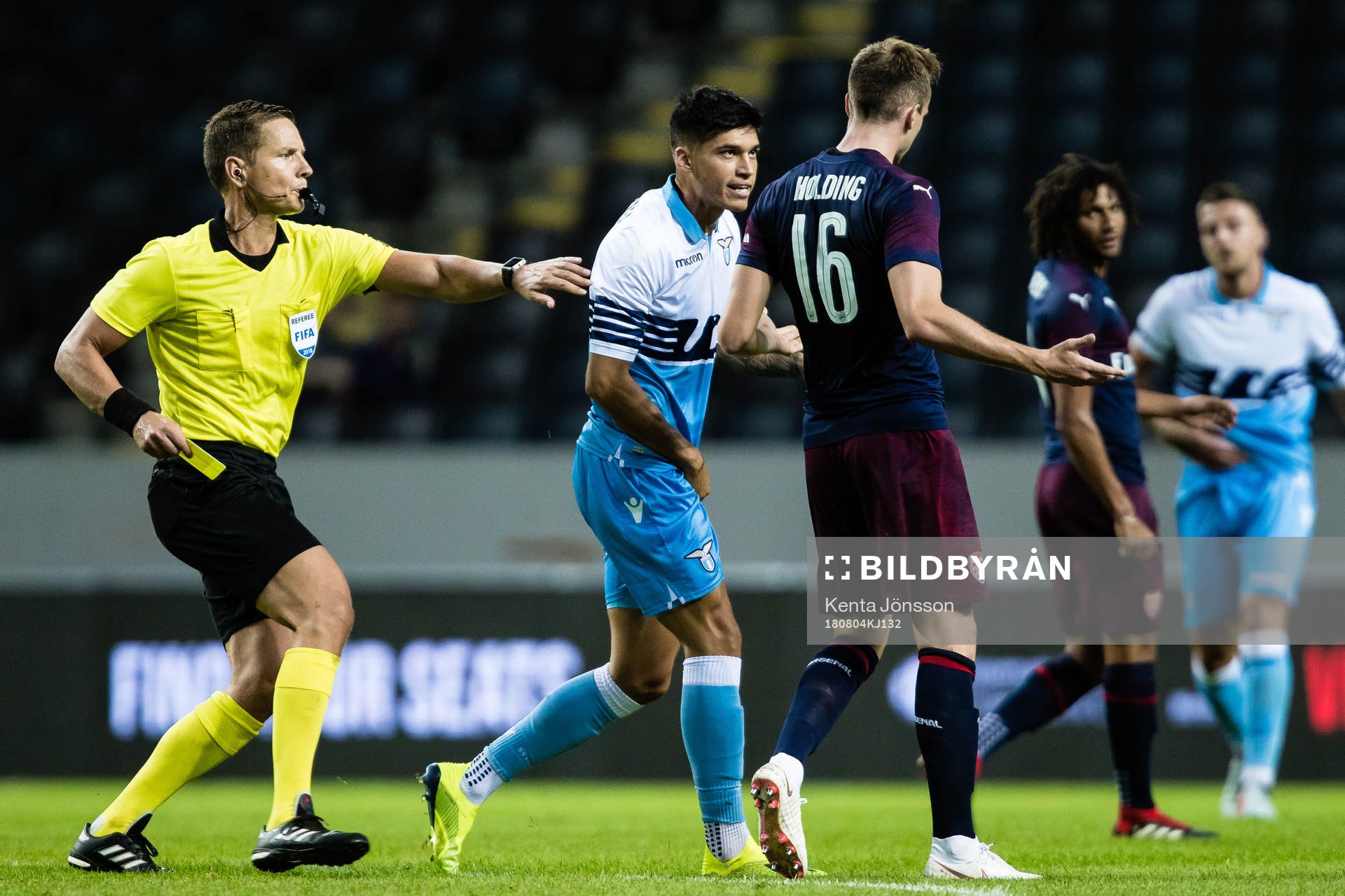 Referee Martin Strömbergsson , Joaquin Correa of Lazio and