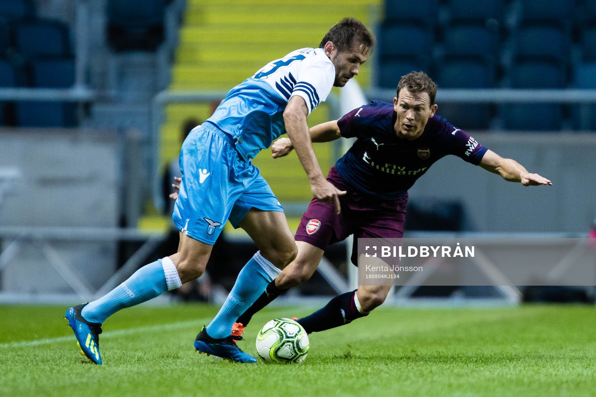 Stephan Lichtsteiner of Arsenal and Senad Lulic of Lazio
