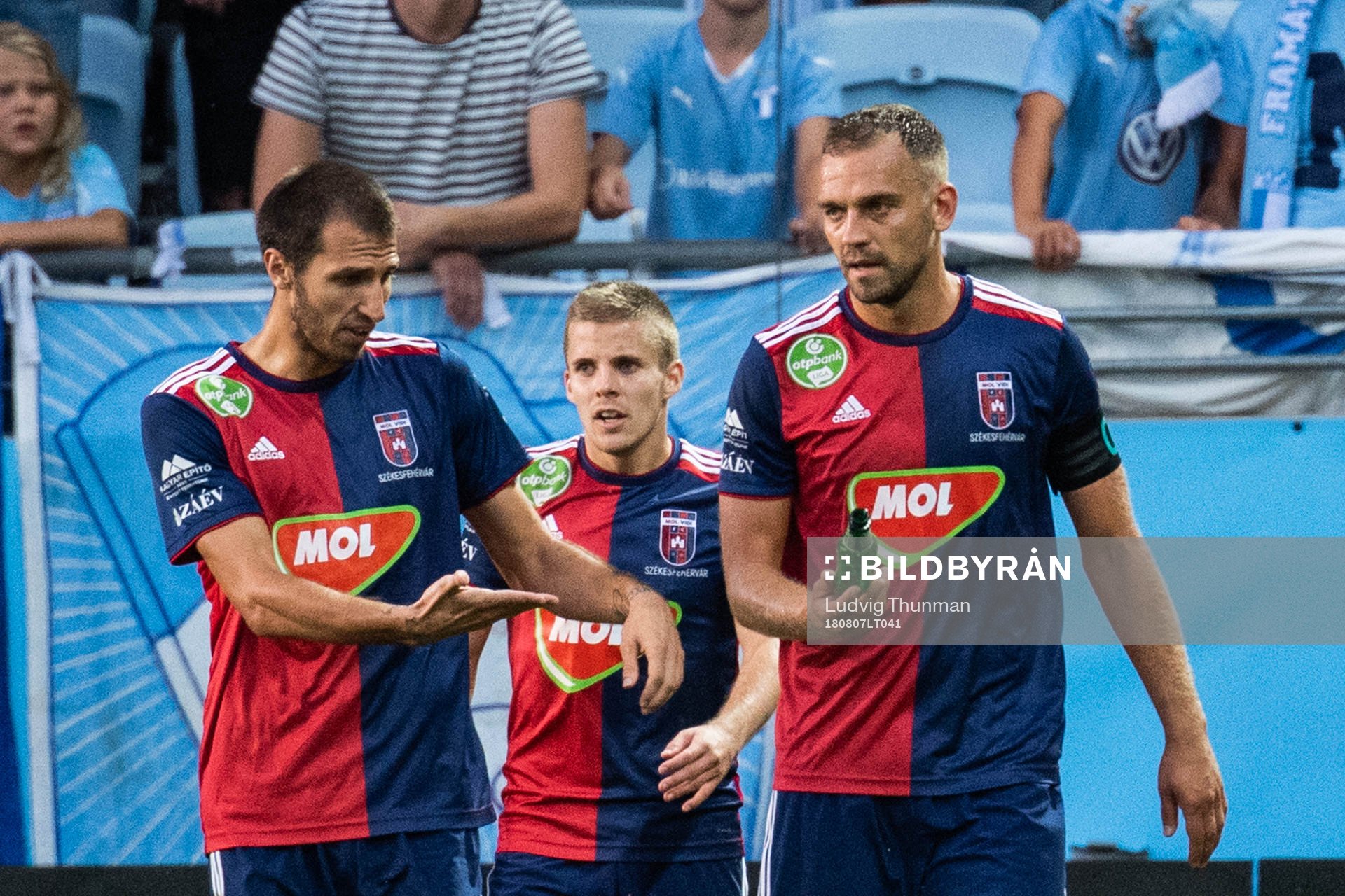 Roland Juhász holds a bottle which hit Anel Hadžić of Vidi when they celebrated 1-1 during the UEFA Champions League qualifying match between Malmö FF and Vidi on August 7, 2018 in Malmö.
