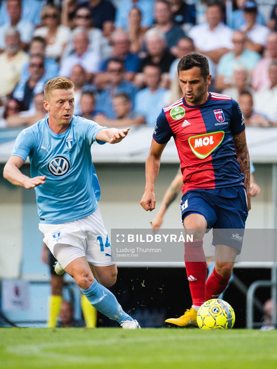 Anders Christiansen of Malmö FF chasing Anel Hadžić of