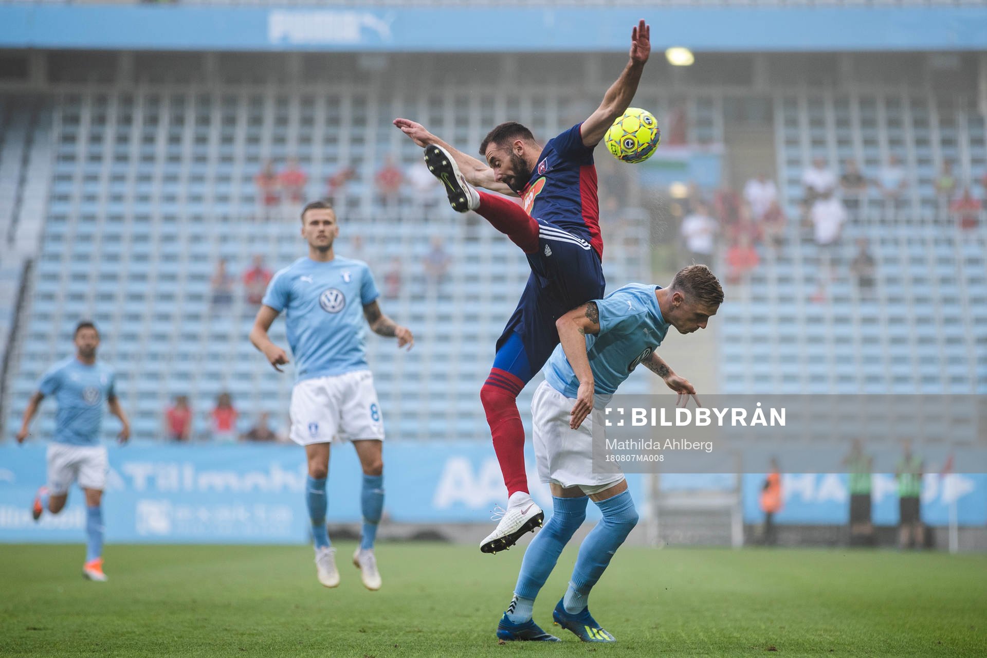 Attila Fiola of Vidi and Sören Rieks of Malmö FF competes