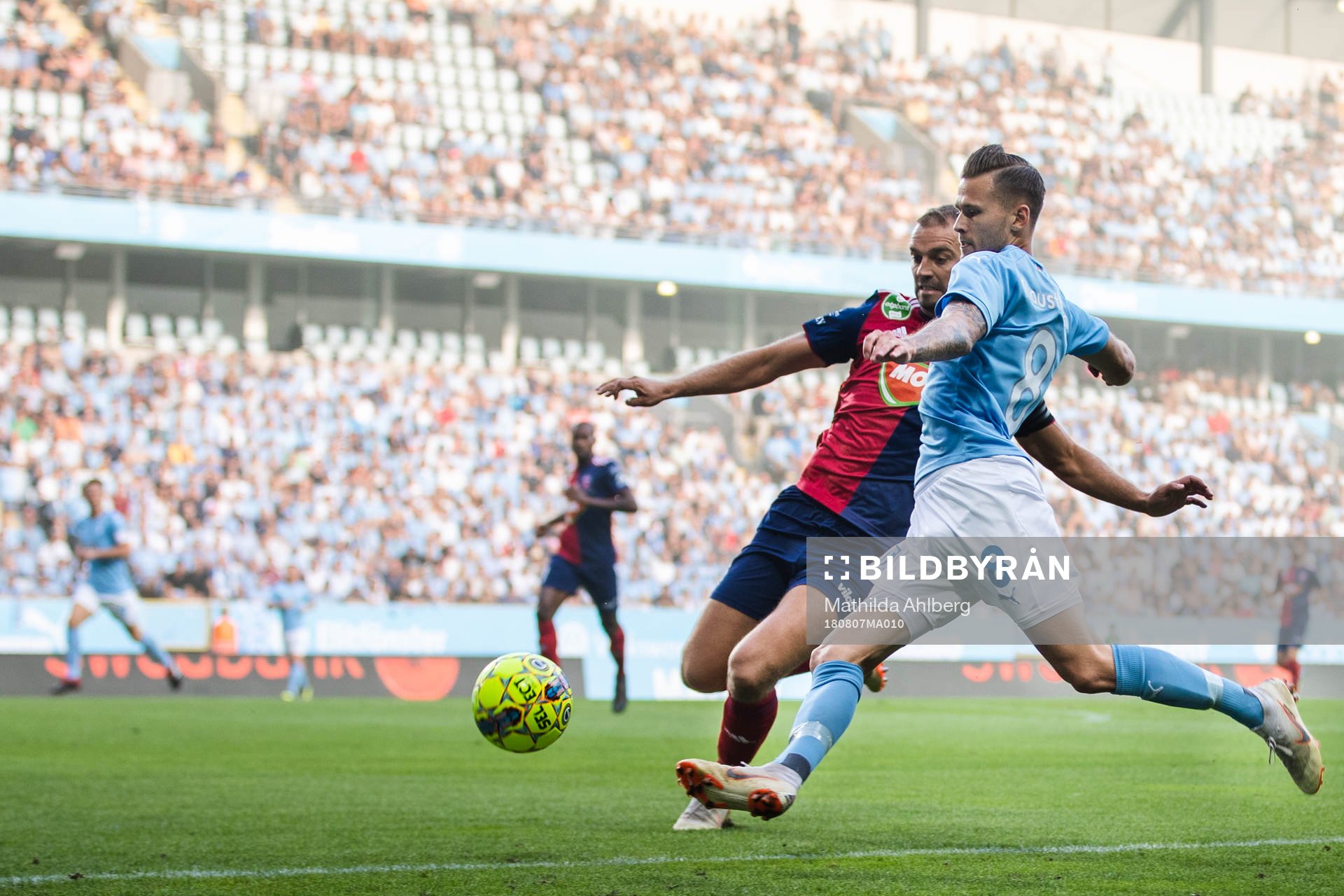 Roland Juhász of Vidi and Arnór Ingvi Traustason of Malmö FF competes for the ball during the UEFA Champions League qualifying match between Malmö FF and Vidi on August 7, 2018 in Malmö.