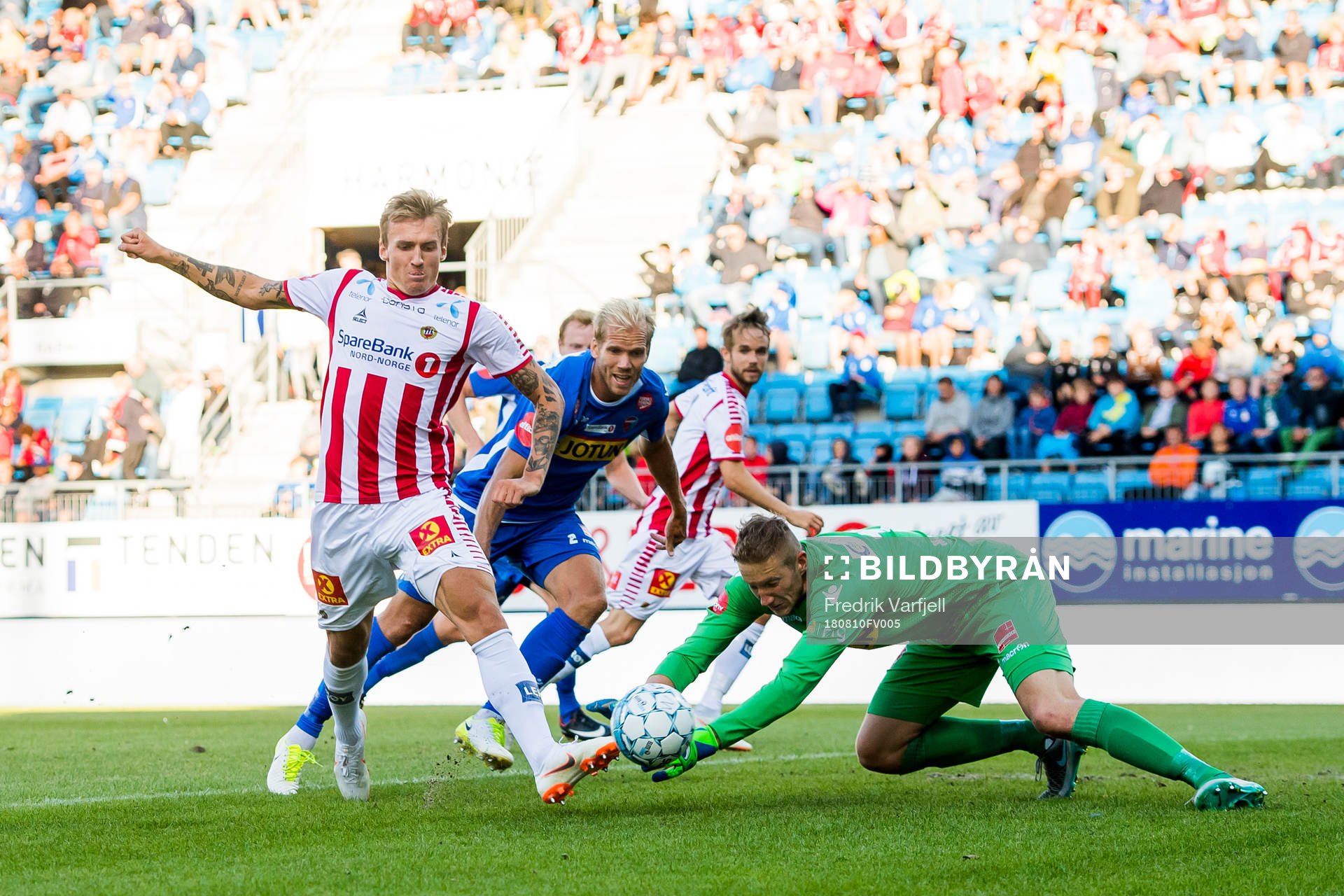 Runar Espejord of Tromsø and goalkeeper Eirik Holmen