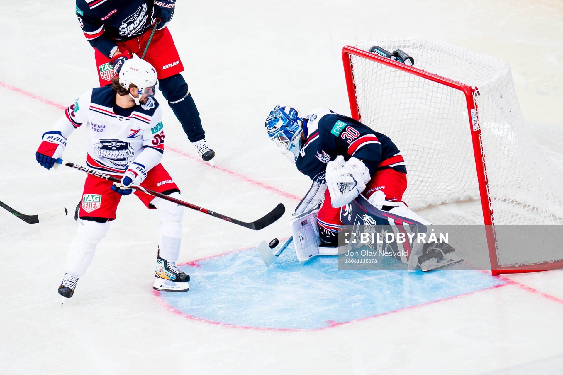 Goaltender Henrik Lundqvist of Team Henke saves a shot by