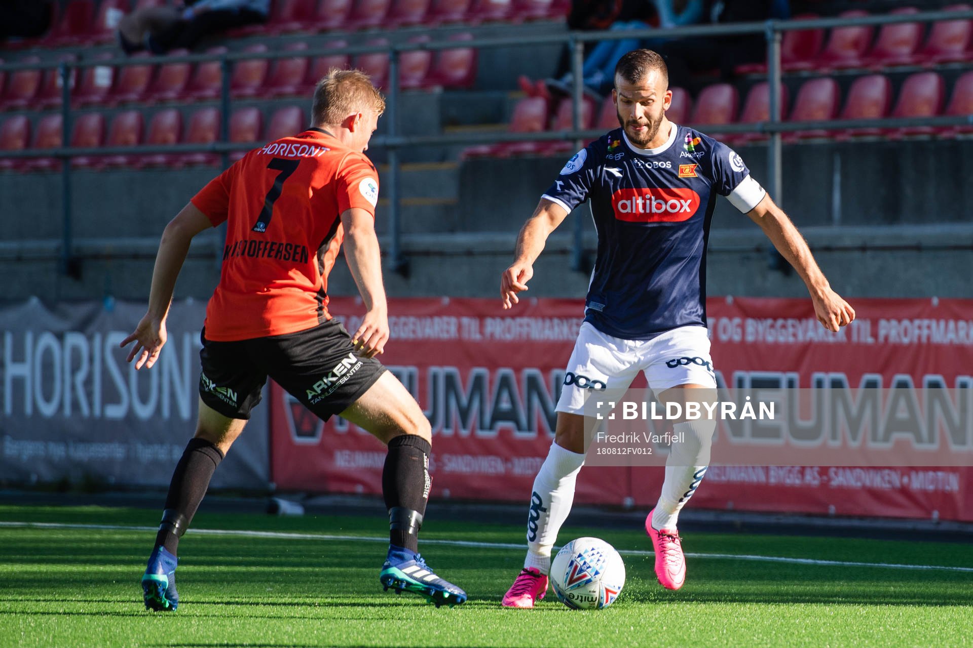Tomas Kristoffersen of Åsane and Zlatko Tripic of Viking