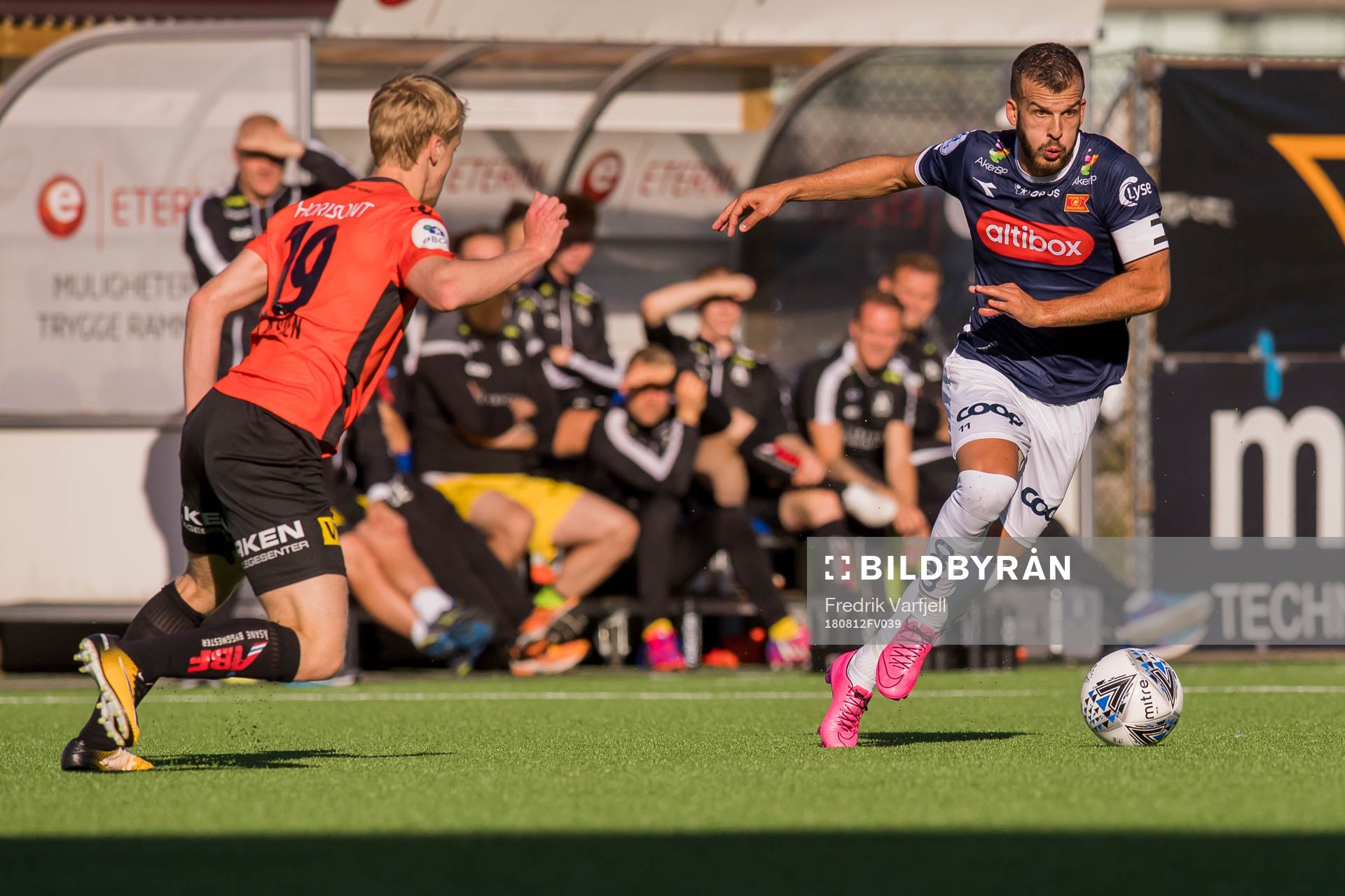 Simen Helland Lassen of Åsane and Zlatko Tripic of Viking