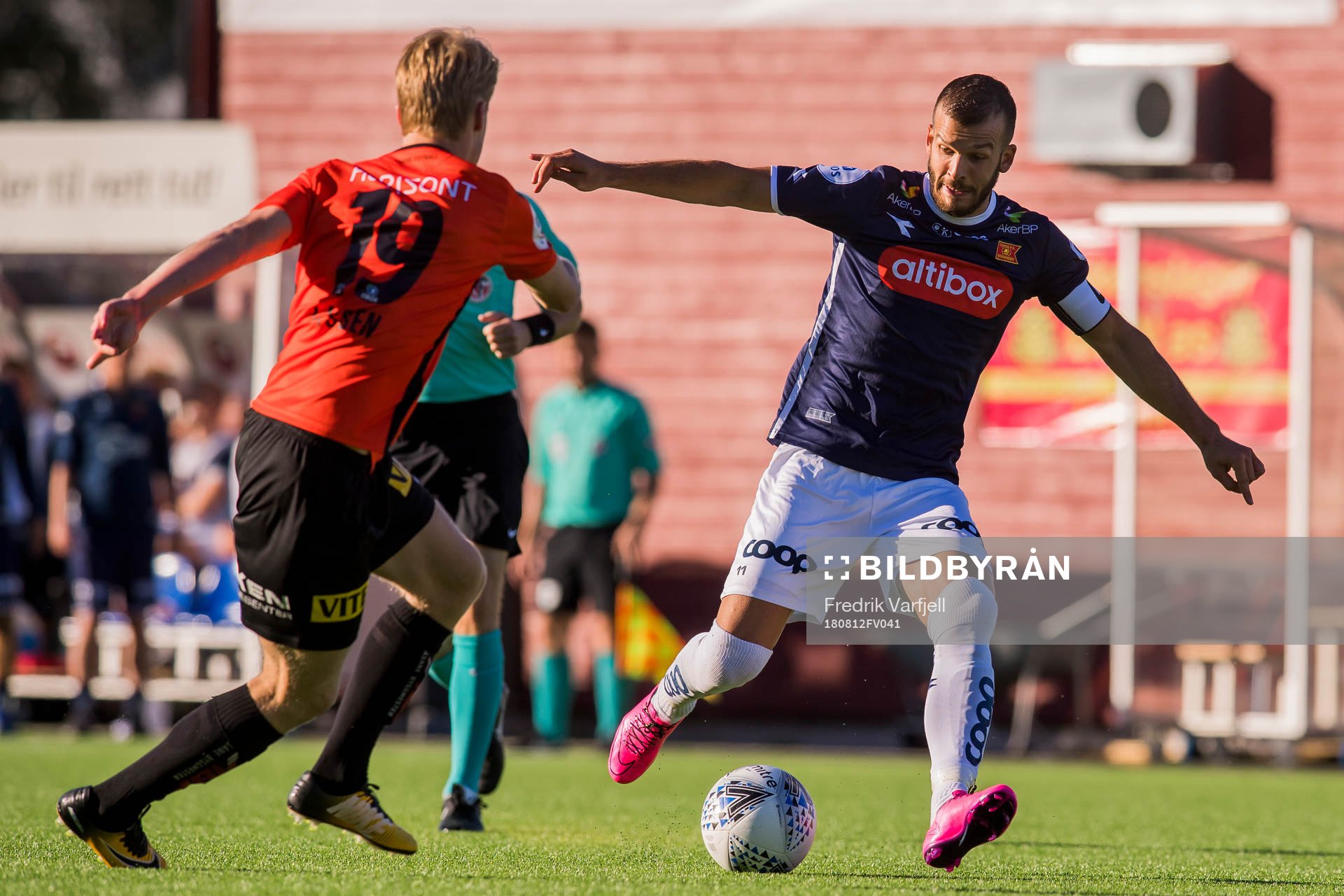 Simen Helland Lassen of Åsane and Zlatko Tripic of Viking