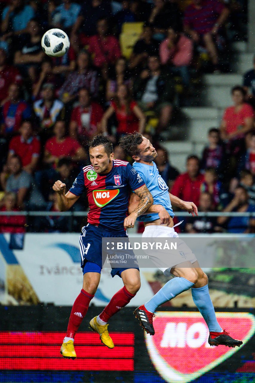 Anel Hadzic of Vidi and Markus Rosenberg of Malmö FF during the UEFA Champions League qualifying match between Vidi and Malmö FF on August 14, 2018 in Felcsut.