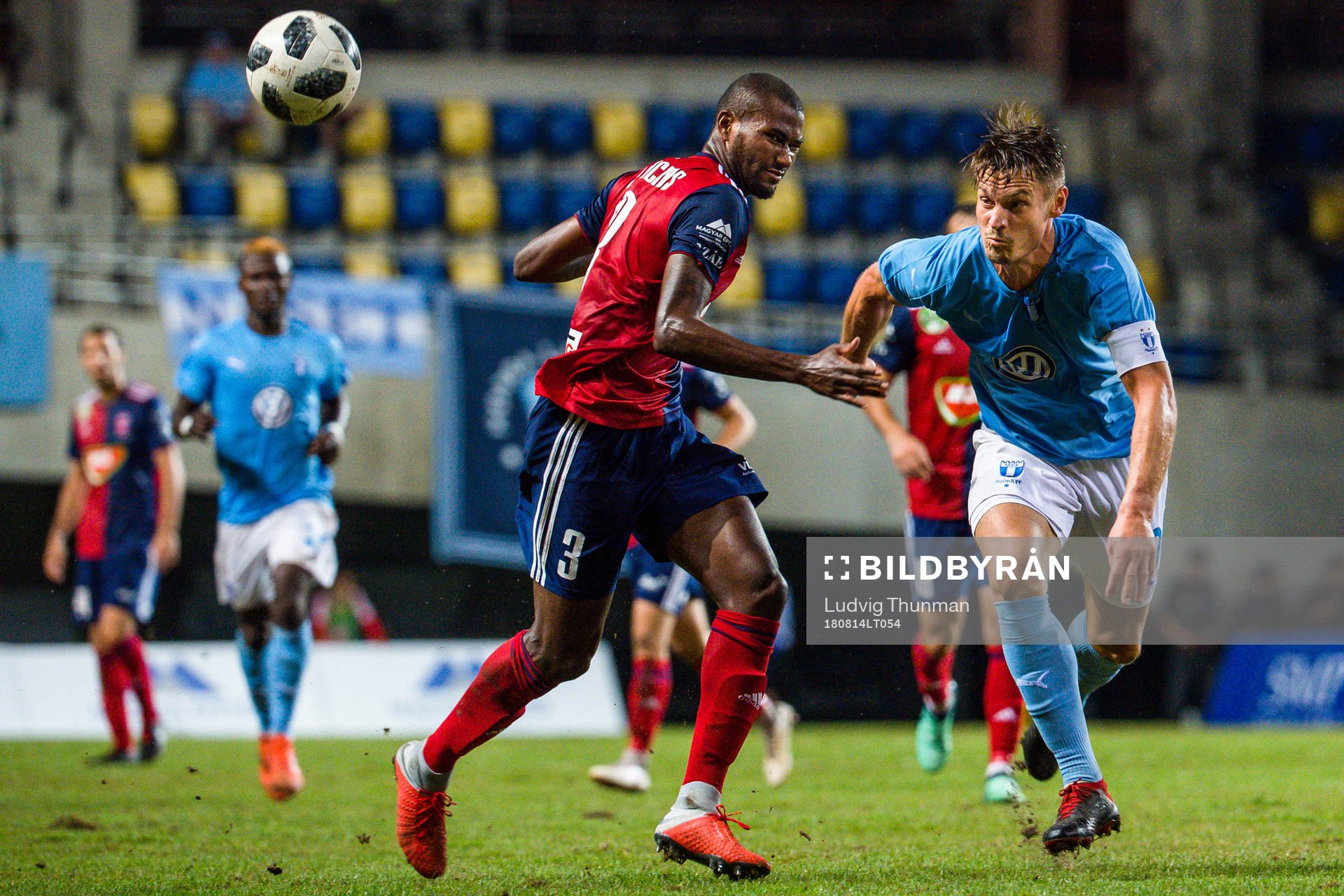 Paulo Vinicius of Vidi against Markus Rosenberg of Malmö FF reacts during the UEFA Champions League qualifying match between Vidi and Malmö FF on August 14, 2018 in Felcsut.