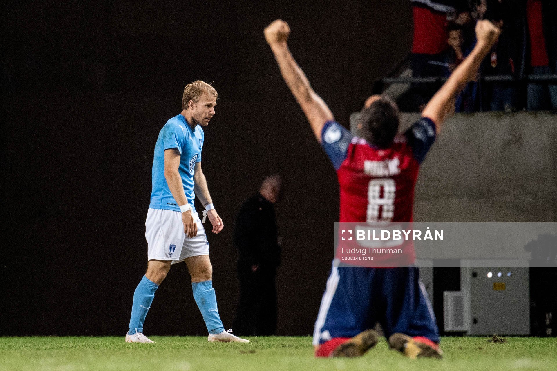 Oscar Lewicki of Malmö FF looks dejected while Anel Hadzic