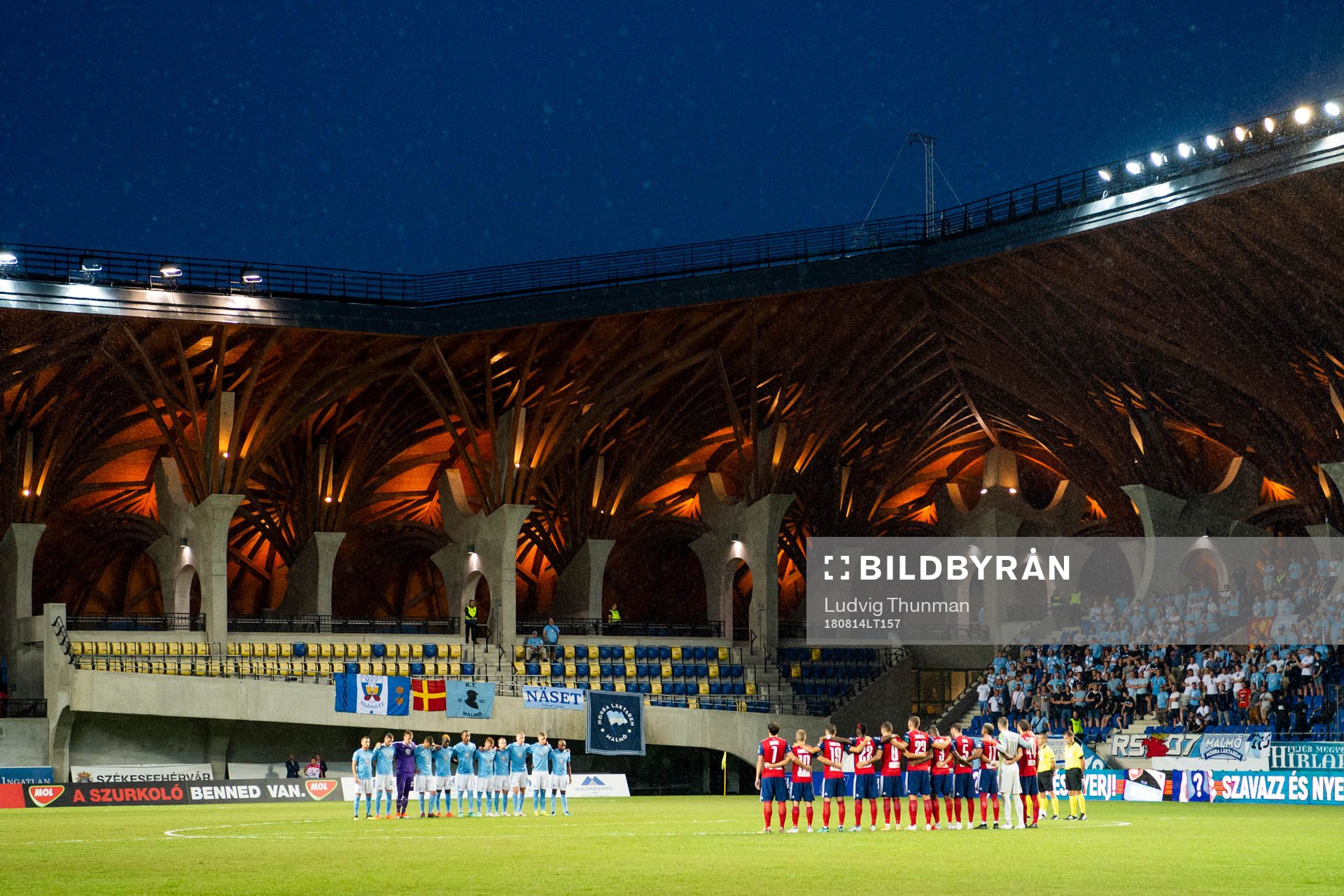 Teams line up for a silent minute