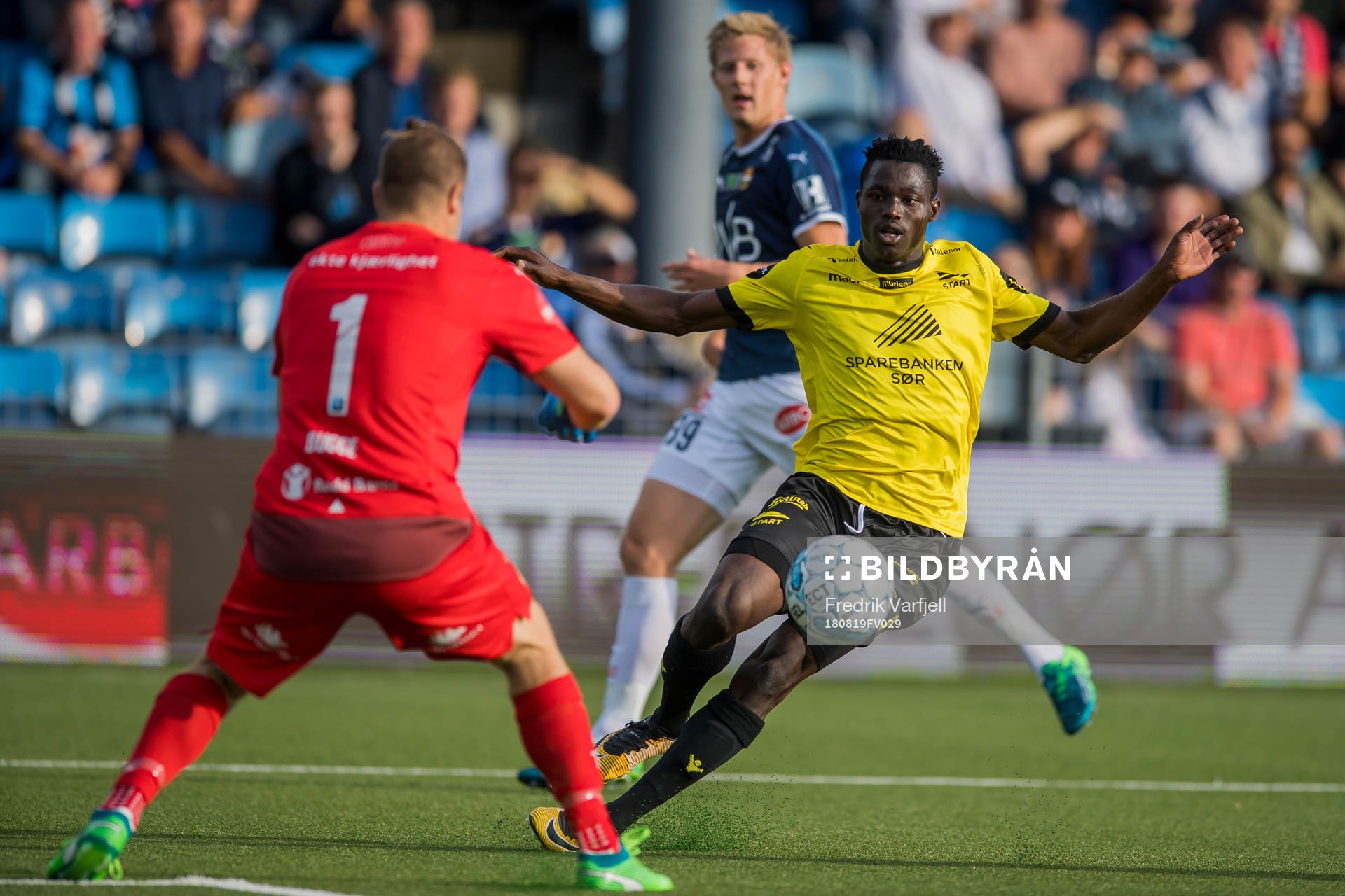 Goalkeeper Espen Bugge Pettersen of Strømsgodset and Adelene Akinyemi of Start during the Eliteserien match between Strømsgodset and Start on August 19, 2018 in Drammen.