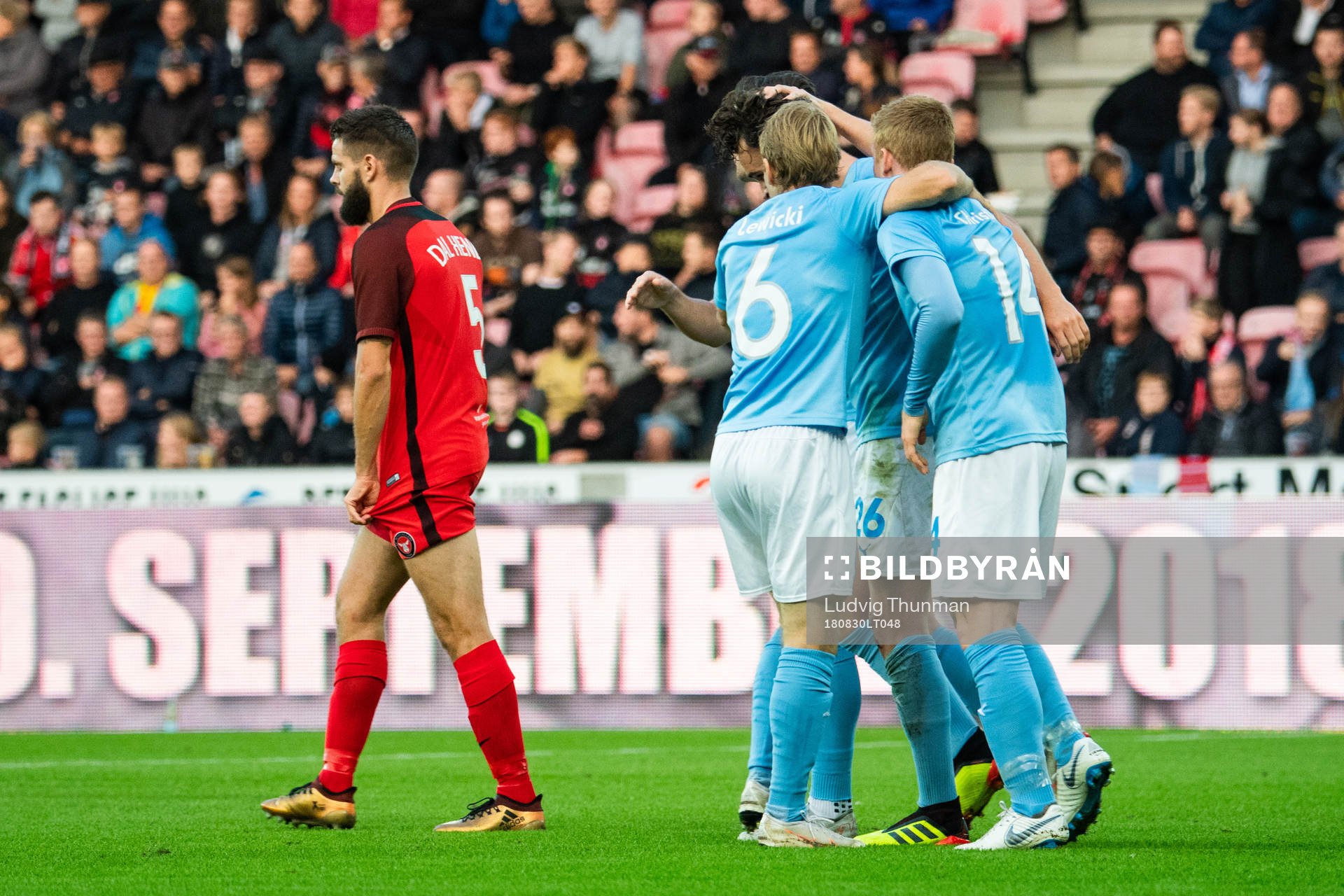 Marc Dal Hende of Midtjylland looks dejected while Malmö FF celebrates after 1-0 during the Europa League qualifying match between Midtjylland and Malmö FF on August 30, 2018 in Herning.