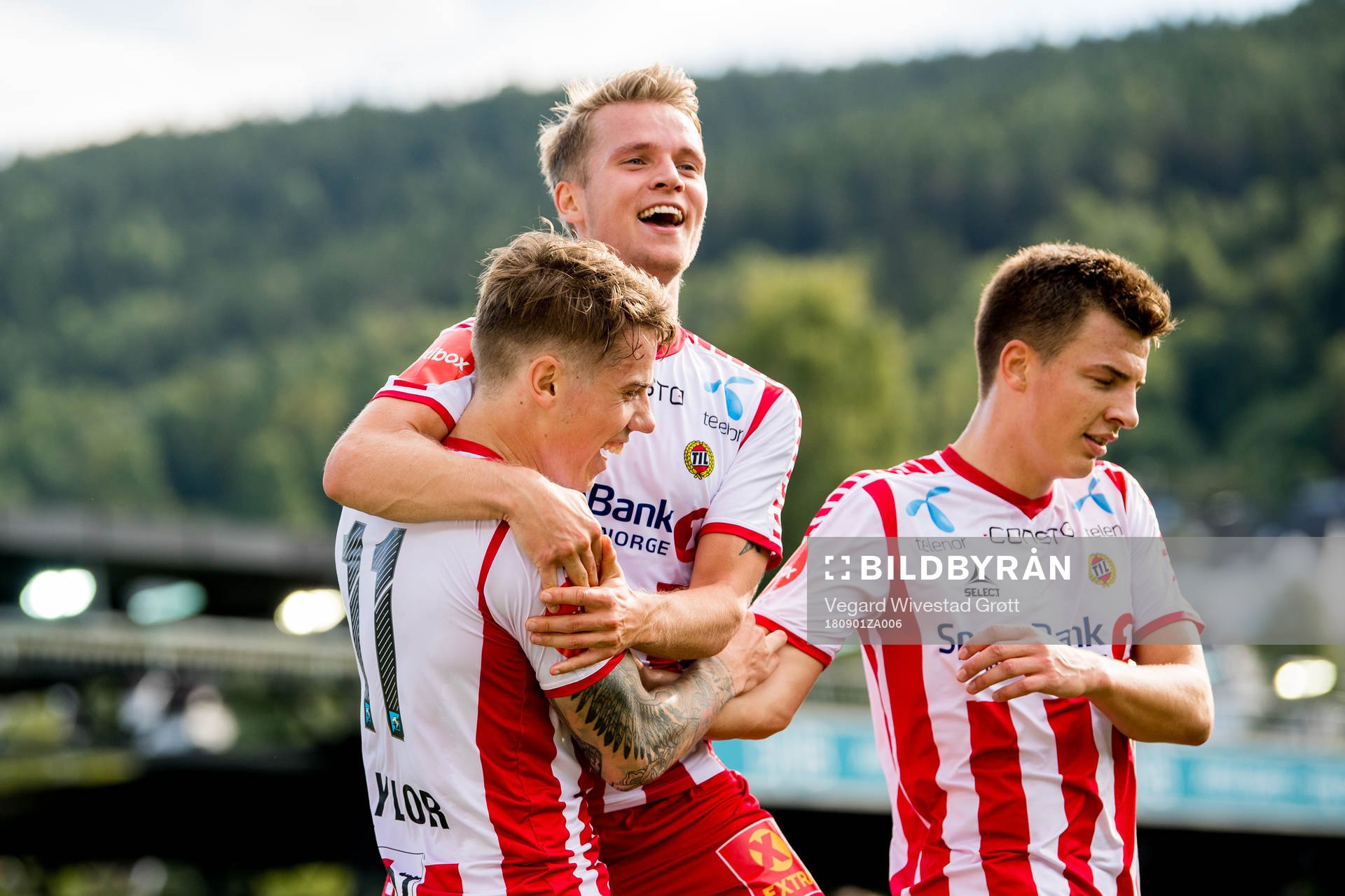 Robert Taylor of Tromsø celebrates with teammates Mikael