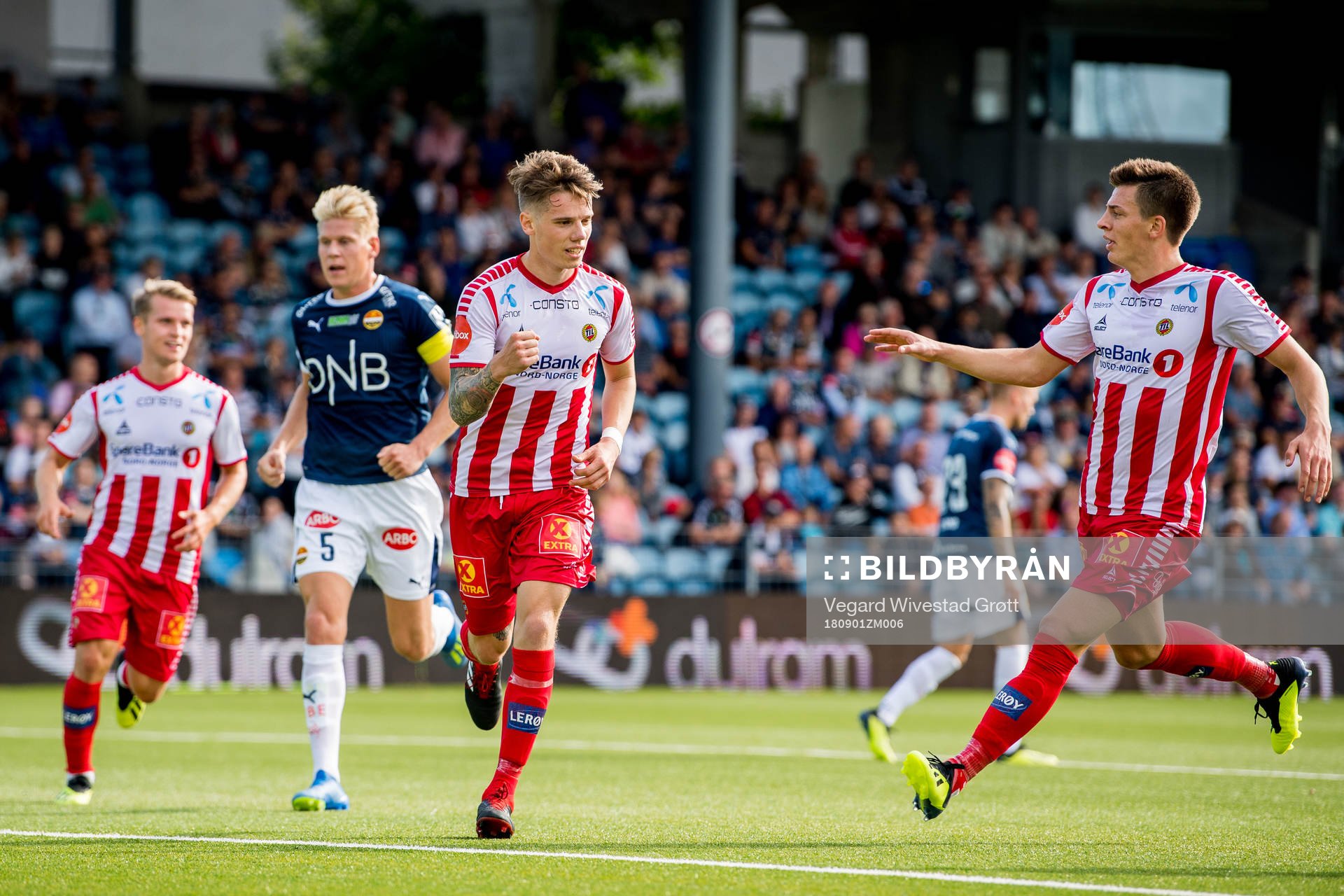 Robert Taylor of Tromsø celebrates with teammate Jostein