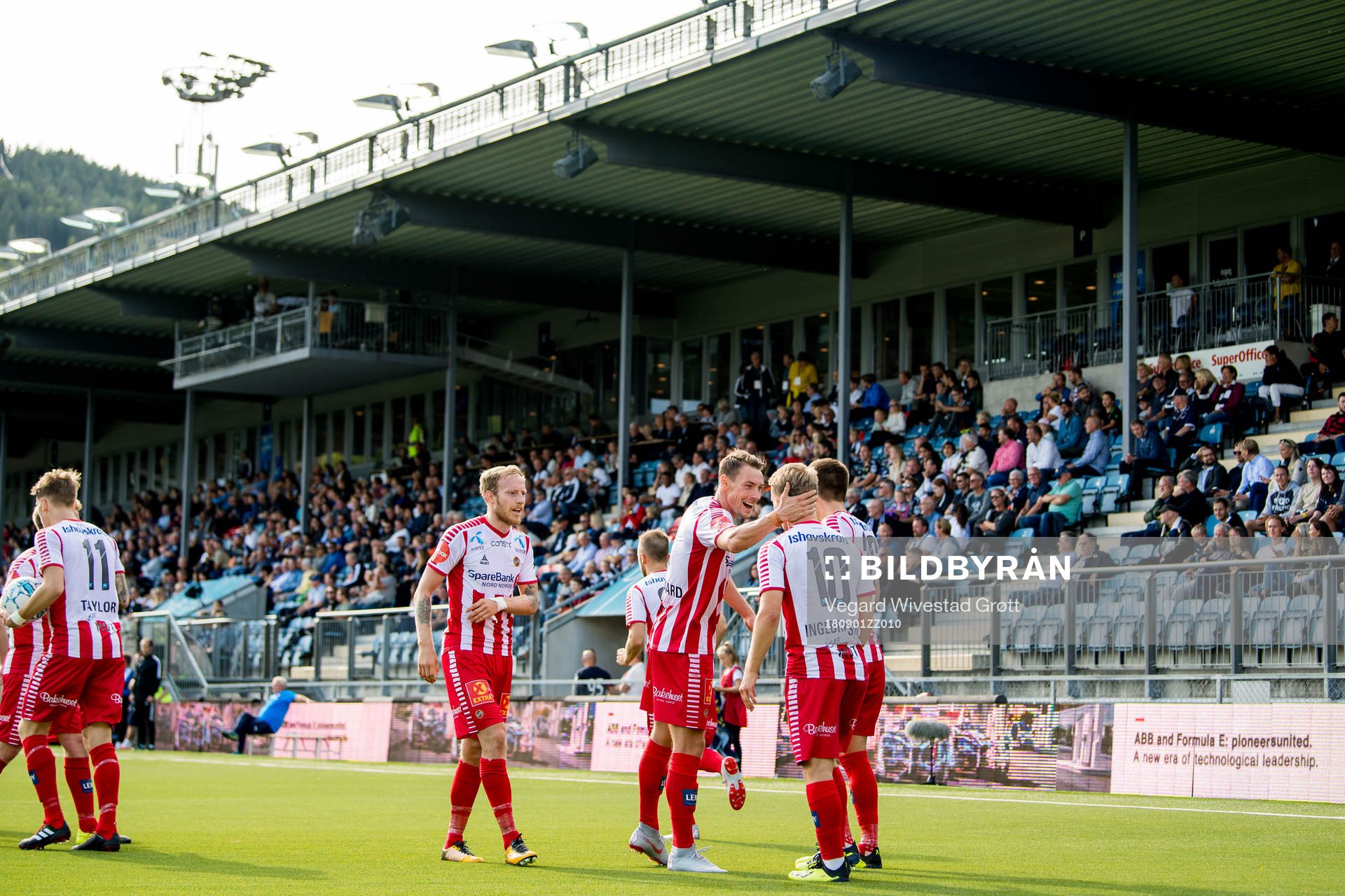 Mikael Nord Ingebrigtsen of Tromsø celebrates with teammate Magnar Ødegaard after scoring 1-1 during the Eliteserien match between Strømsgodset and Tromsø on September 1, 2018 in Drammen.