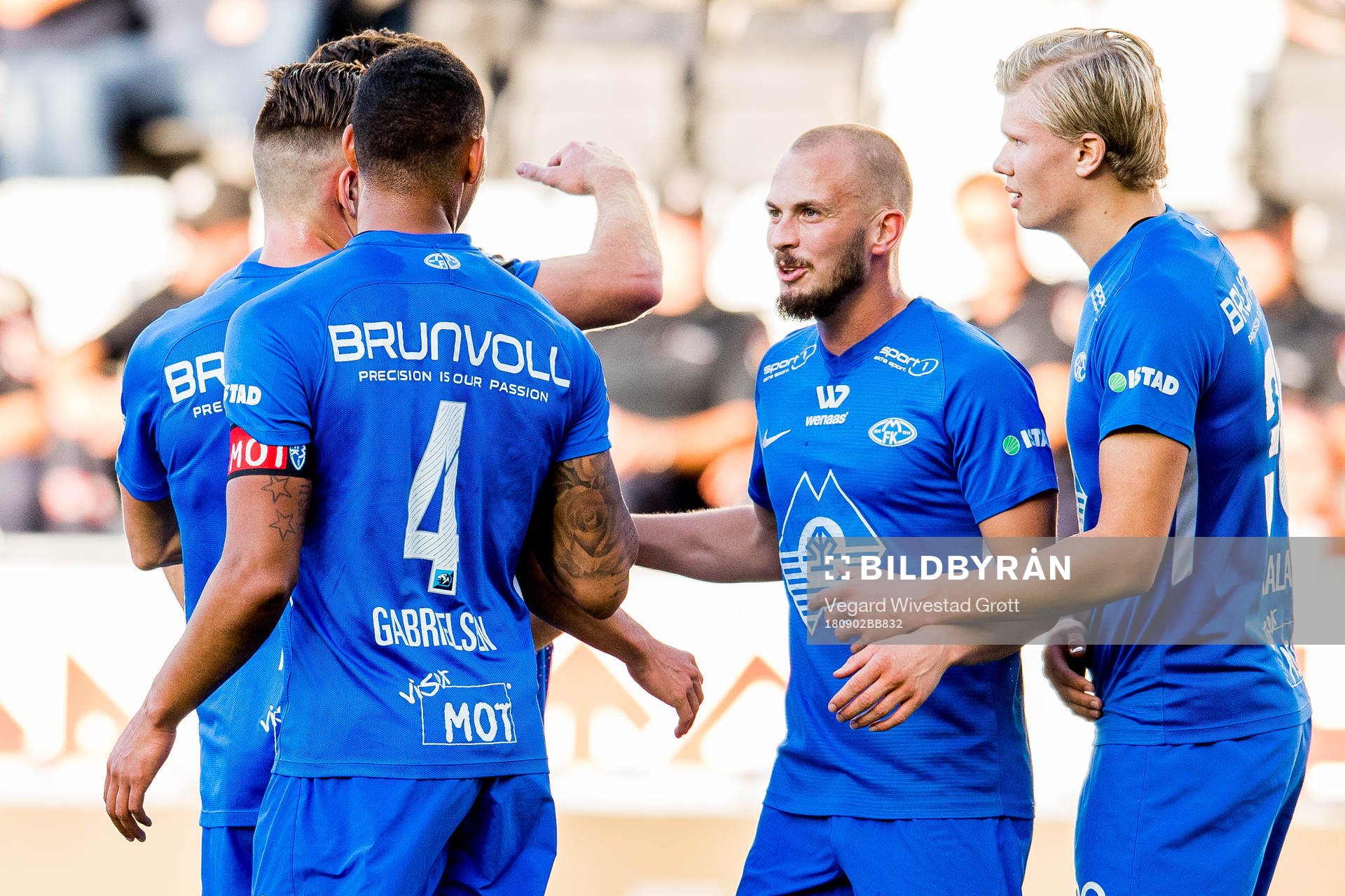 Ruben Gabrielsen of Molde celebrates with teammates Eirik Hestad and Erling Braut Håland after scoring 0-1 during the Eliteserien match between Odd and Molde on September 2, 2018 in Skien.