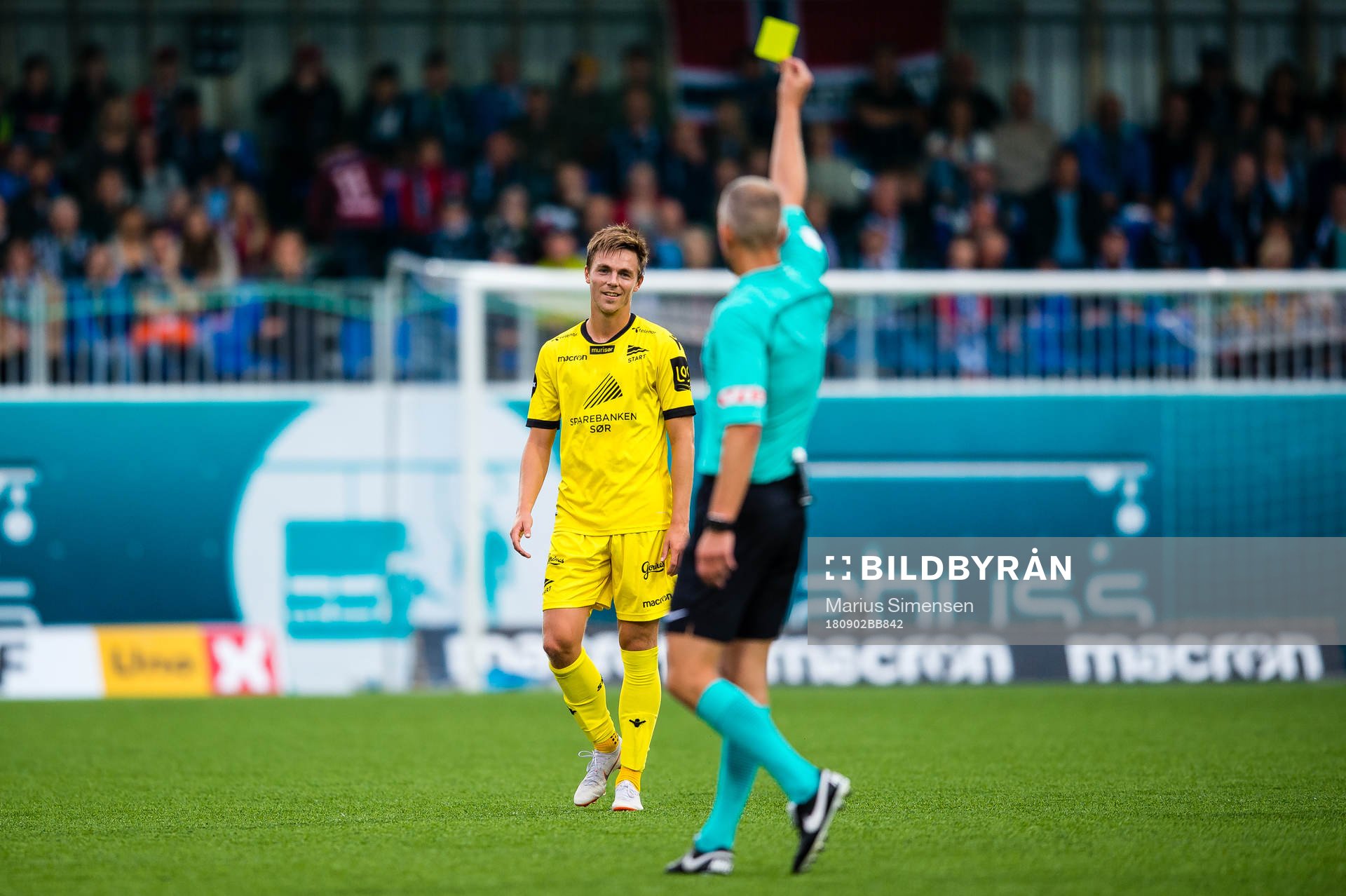 Espen Hammer Berger of Start gets a yellow card