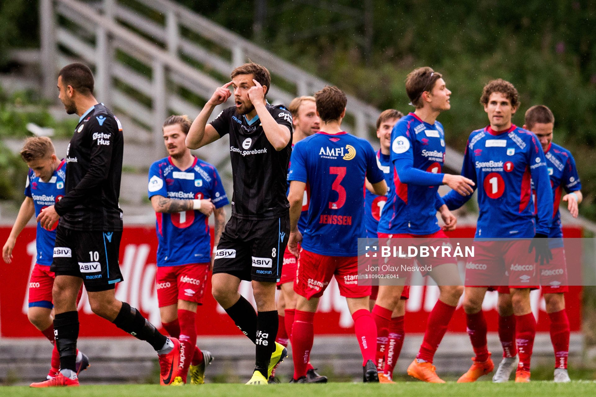 Remi Johansen of Sandnes Ulf reacts while the players of