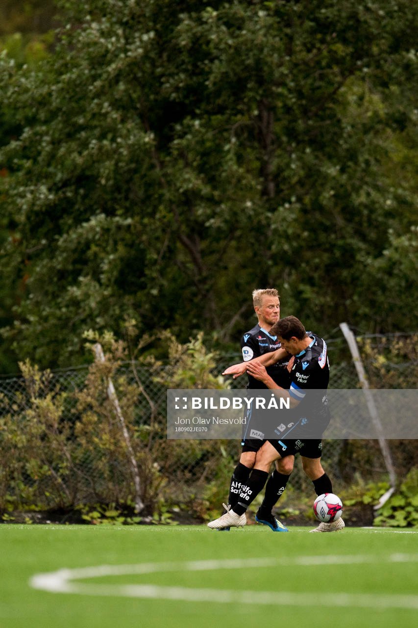 Tapio Heikkilä and Niels Vorthoren of Sandnes Ulf collide during the OBOS-ligaen match between Tromsdalen and Sandnes Ulf on September 2, 2018 in Tromsø.