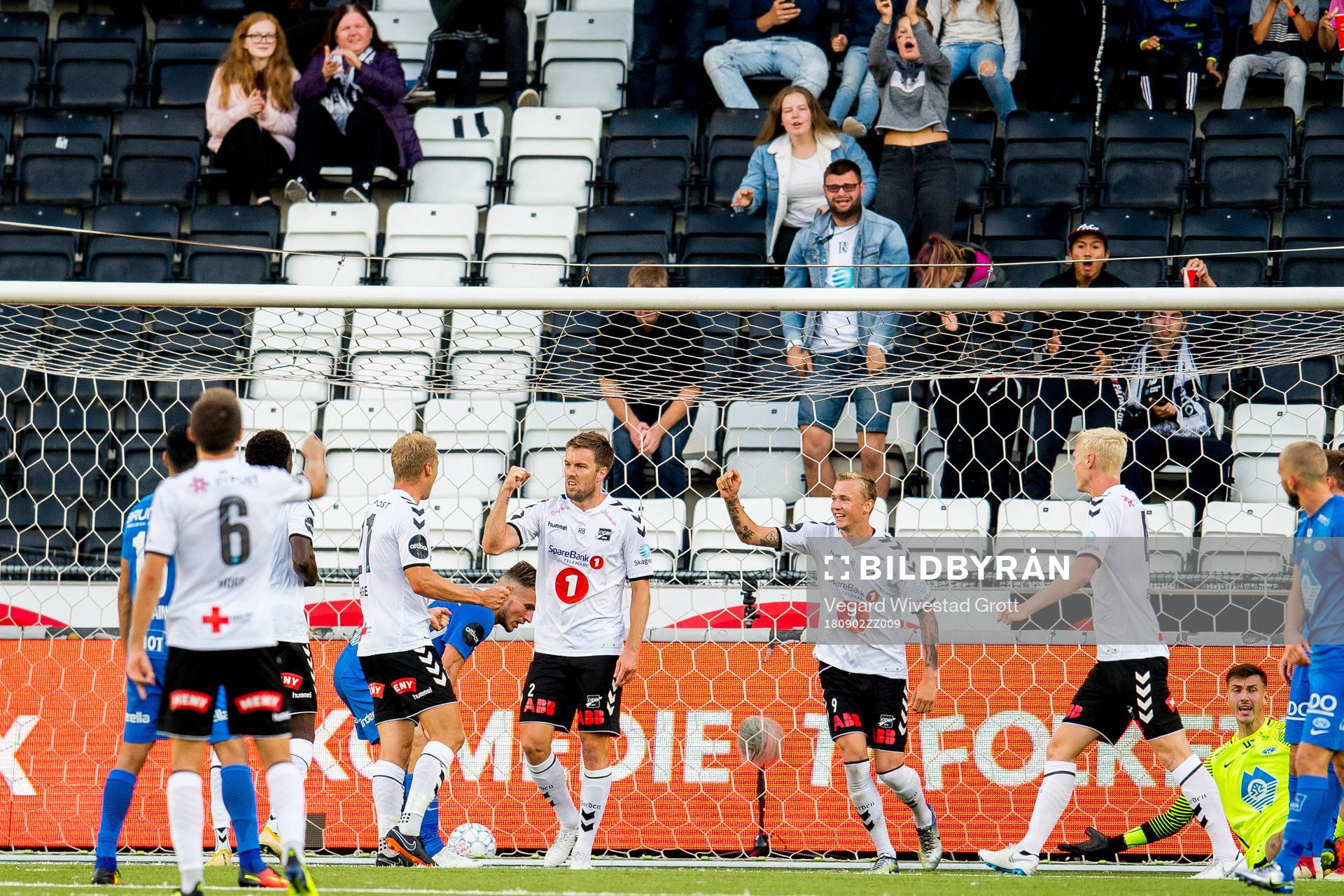 Espen Ruud of Odd celebrates with Birk Risa and teammates after scoring 1-1 during the Eliteserien match between Odd and Molde on September 2, 2018 in Skien.