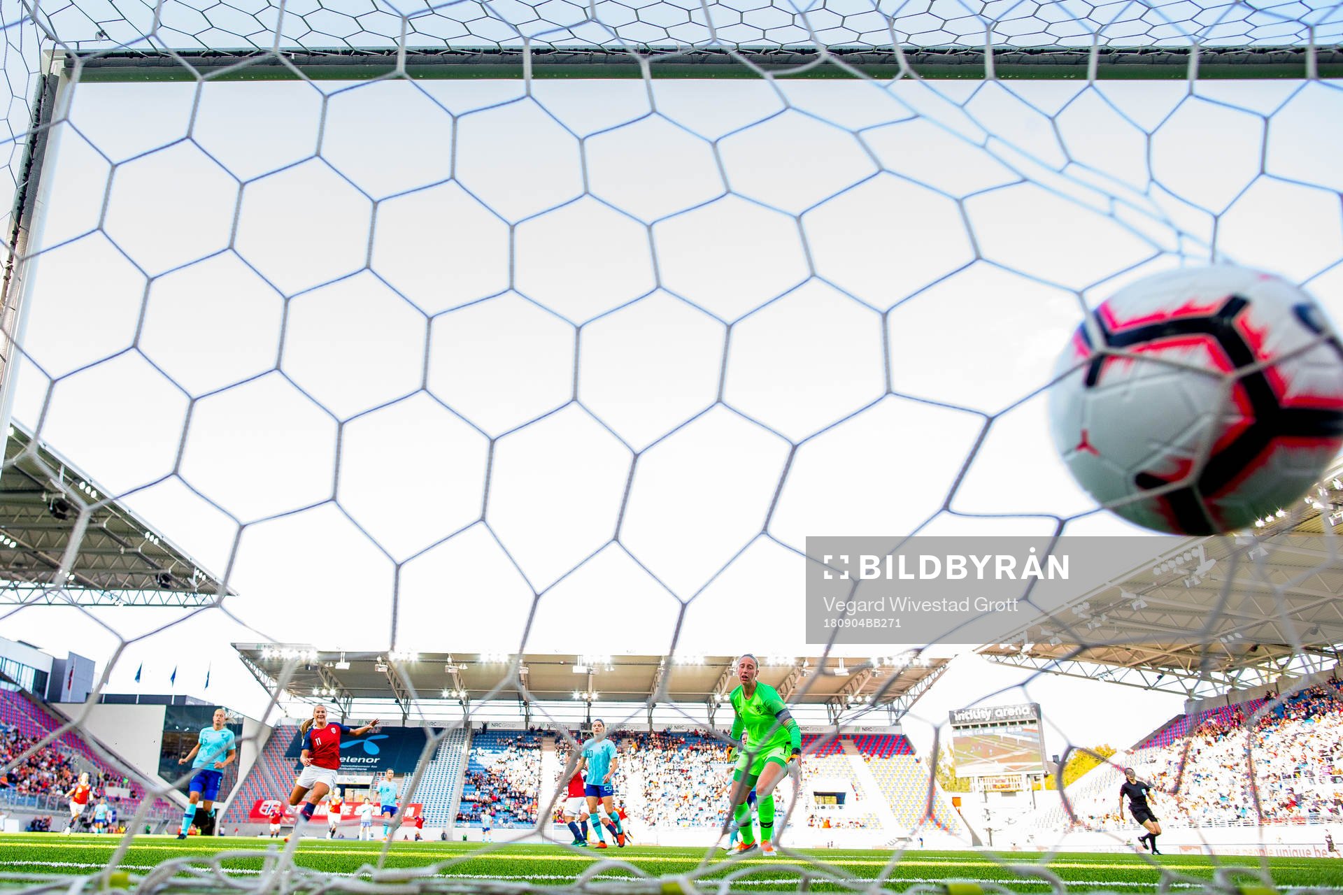 Isabell Herlovsen of Norway scores 2-0 behind goalkeeper