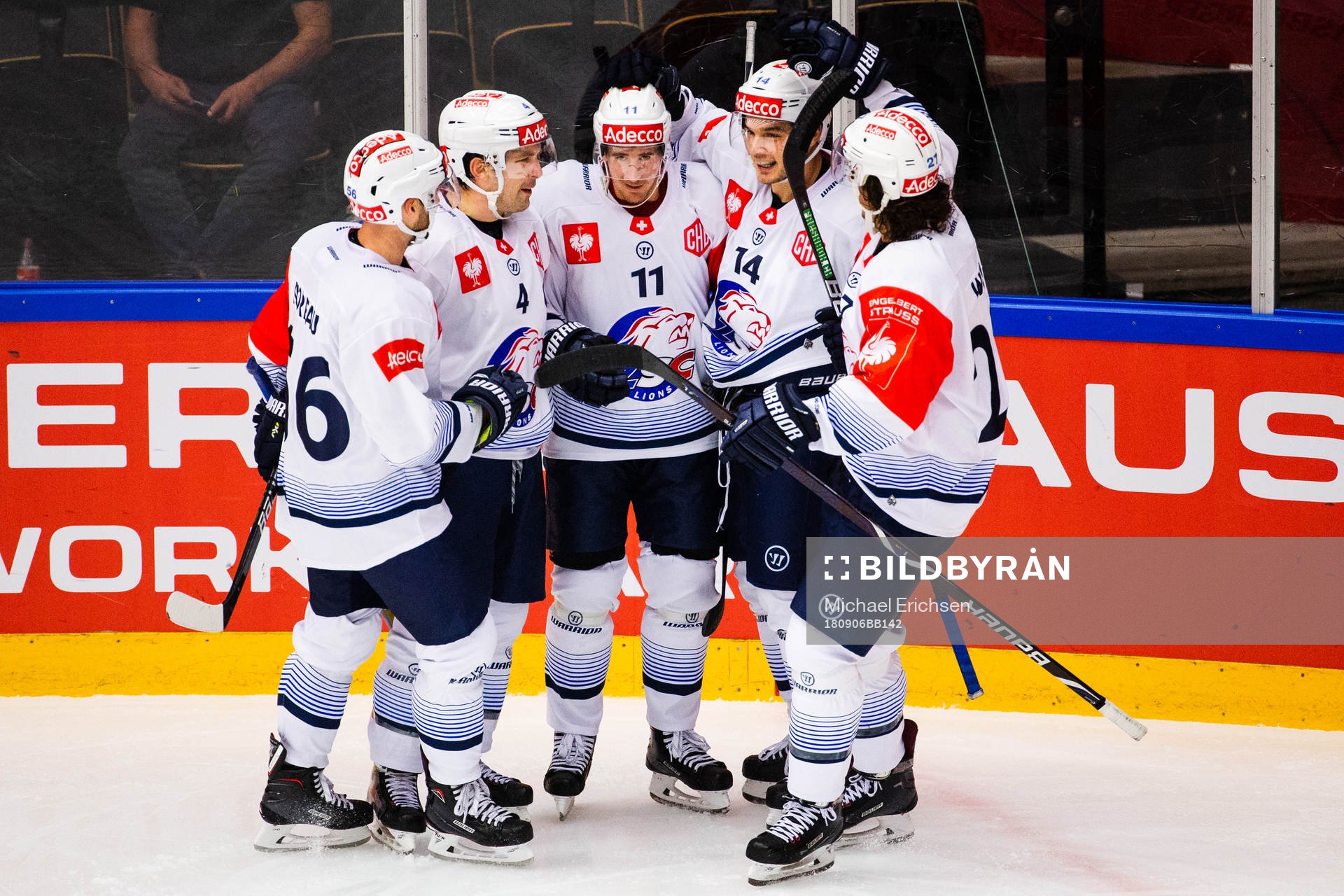 Roman Cervenka (middle) celebrates with Patrick Geering and