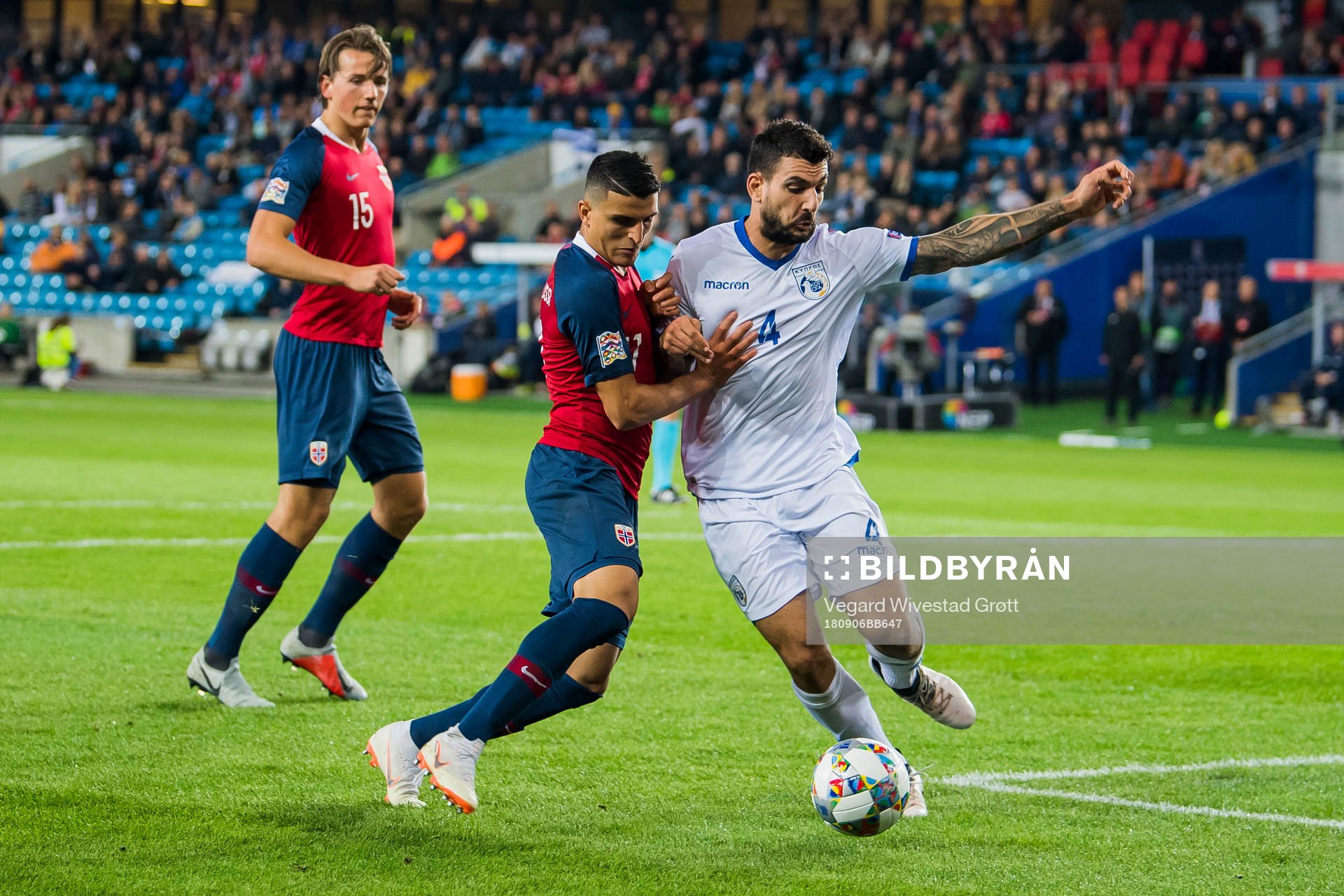Mohamed Elyounoussi of Norway and Giorgos Merkis of Cyprus