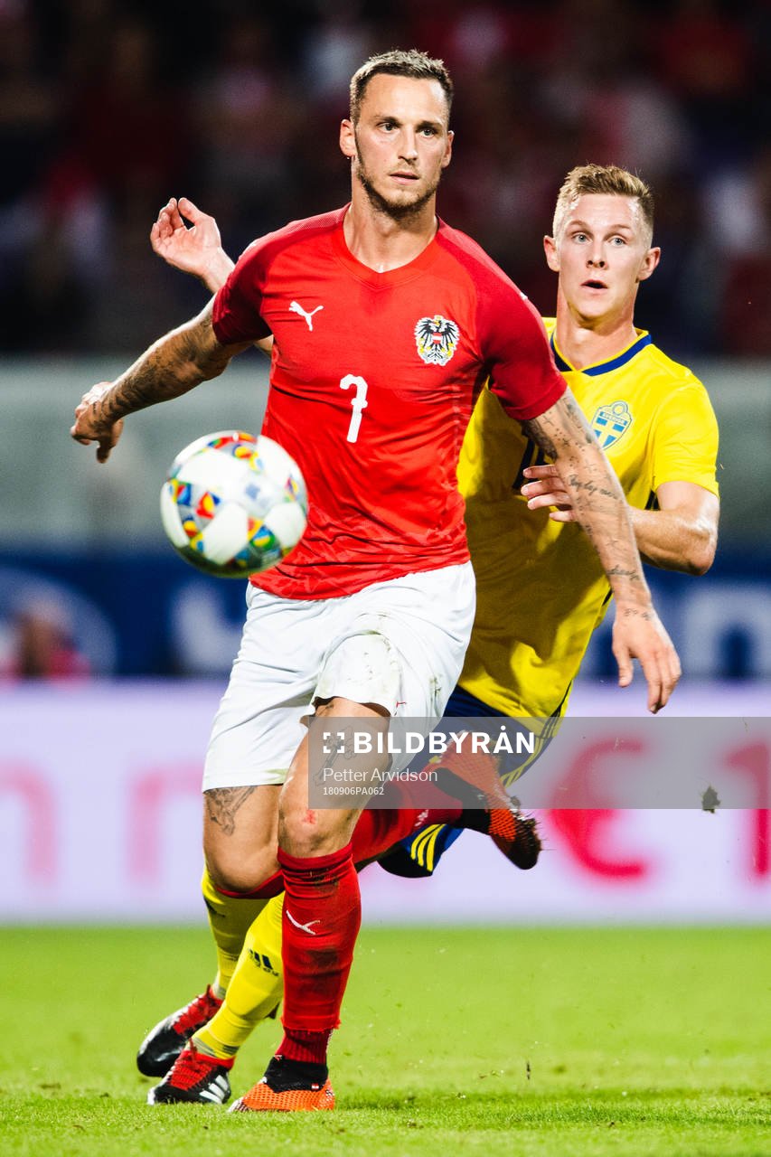 Emil Krafth of Sweden and Marko Arnautovic of Austria