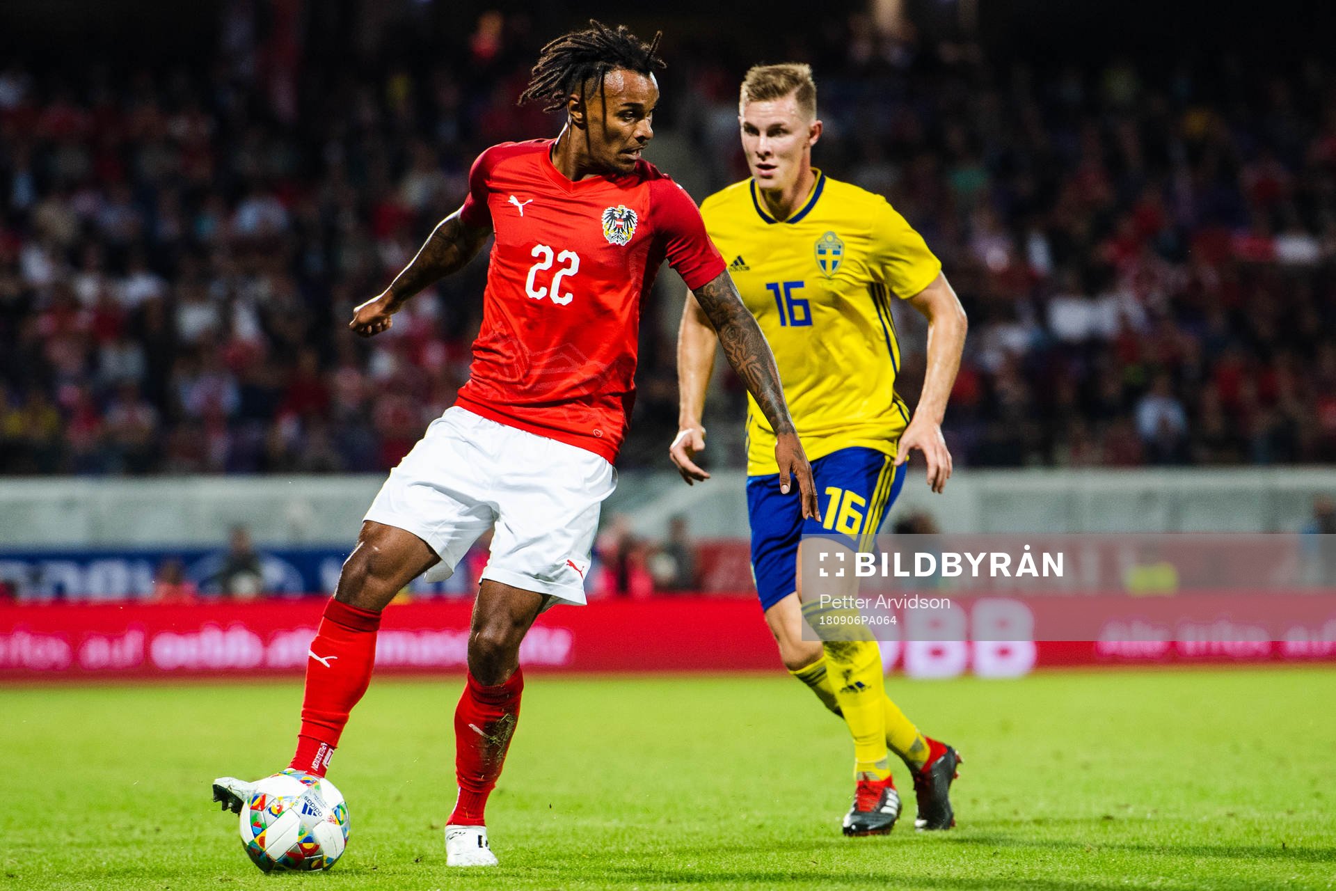 Valentino Lazaro of Austria and Emil Krafth of Sweden
