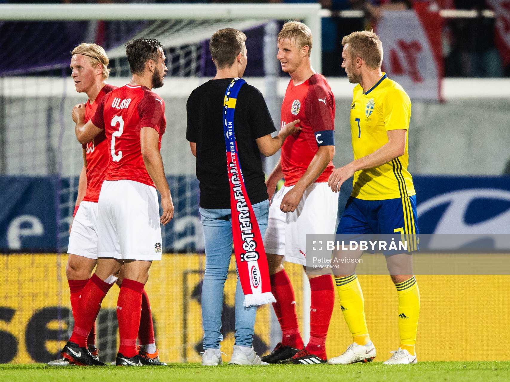 A pitch invader among Sebastian Larsson of Sweden and