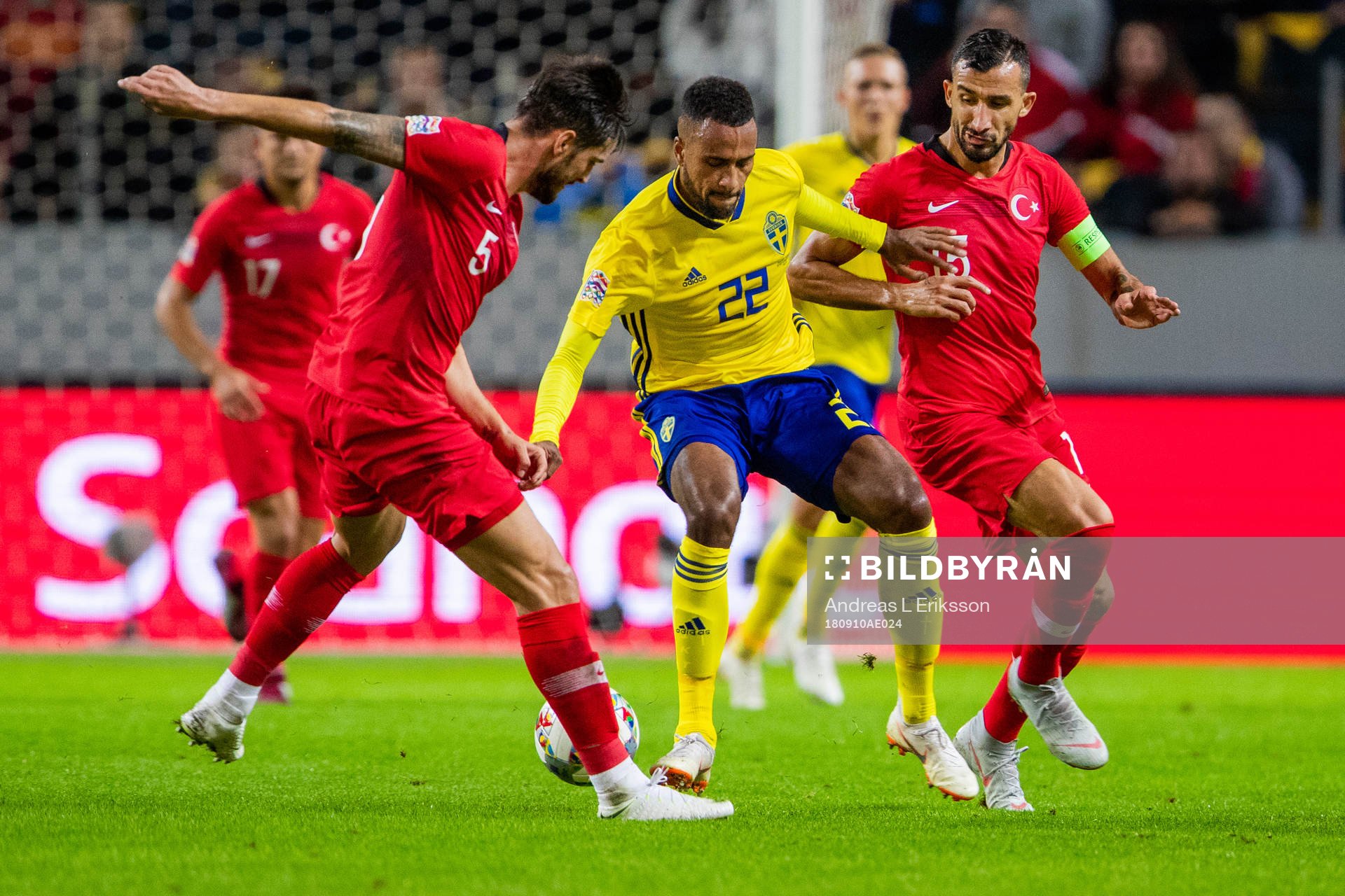Okay Yokuslu and Mehmet Topal of Turkey against Isaac Kiese Thelin of Sweden during the Nations League match between Sweden and Turkey on september 10, 2018 in Stockholm.