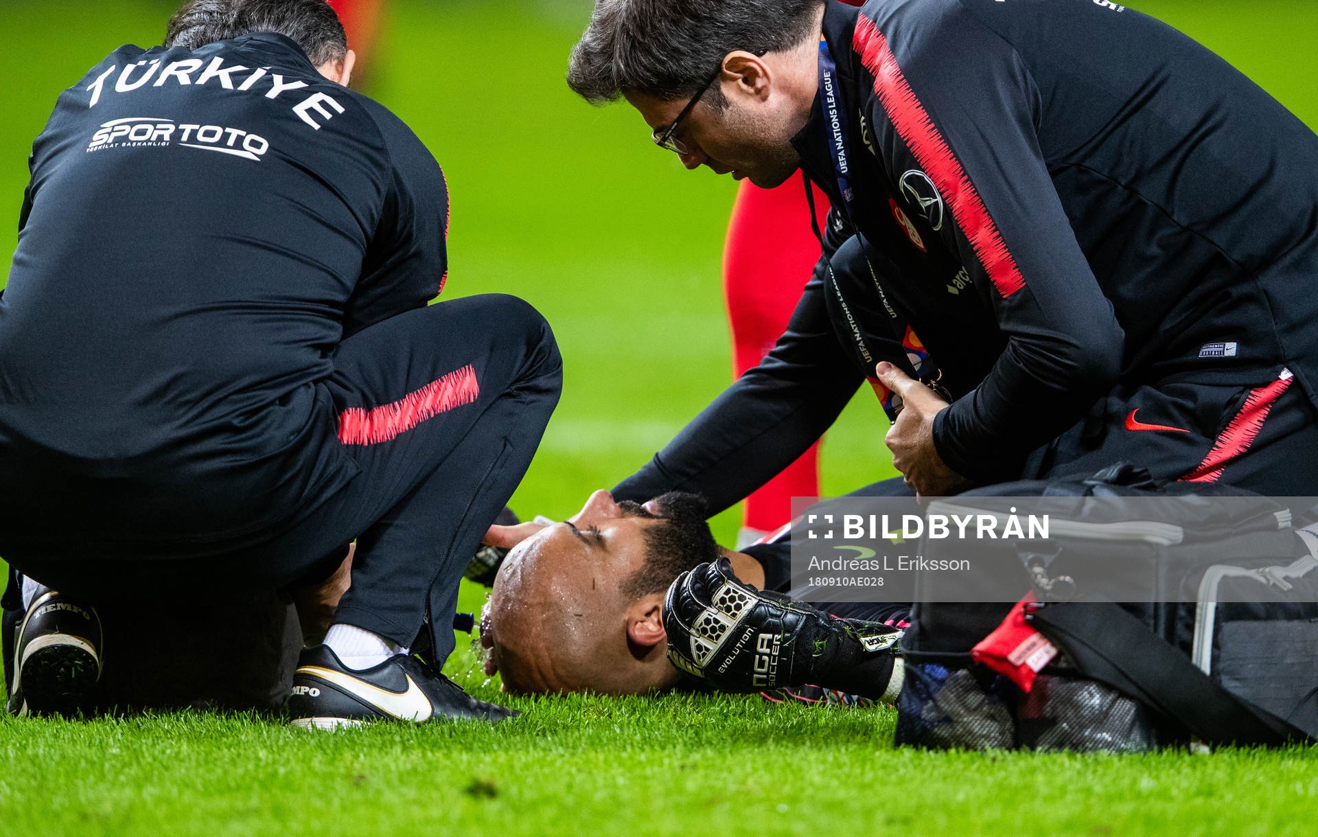 Goalkeeper Sinan Bolat of Turkey is in pain