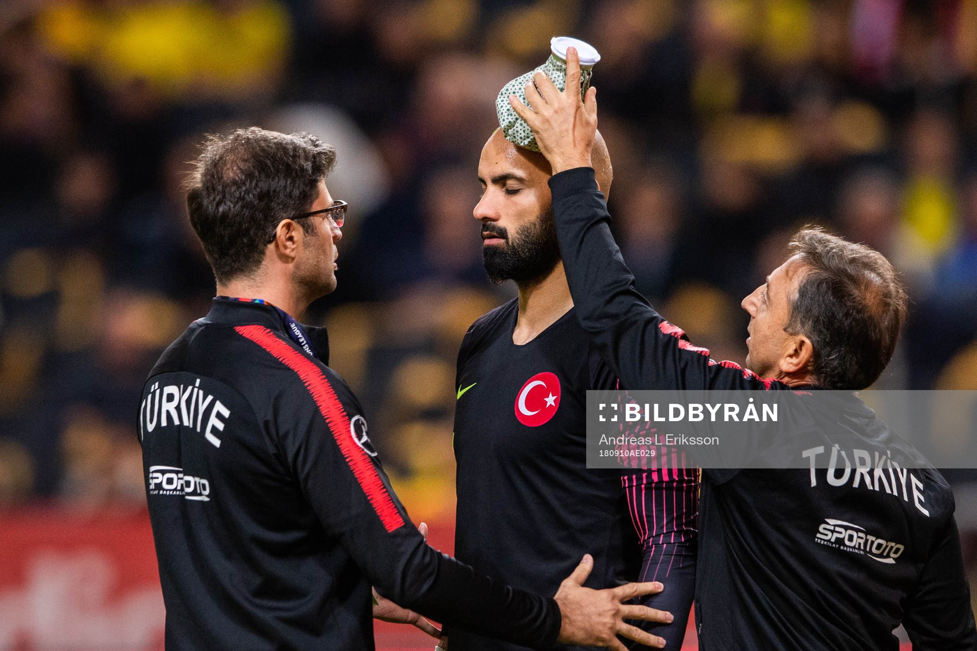 goalkeeper Sinan Bolat of Turkey is in pain